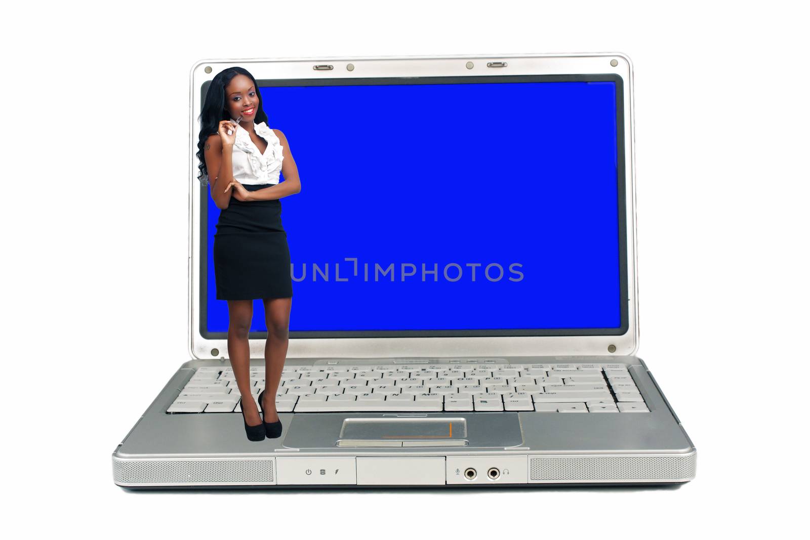 An extraordinarily beautiful young businesswoman holding an ink pen stands on a laptop computer with a blank blue screen.