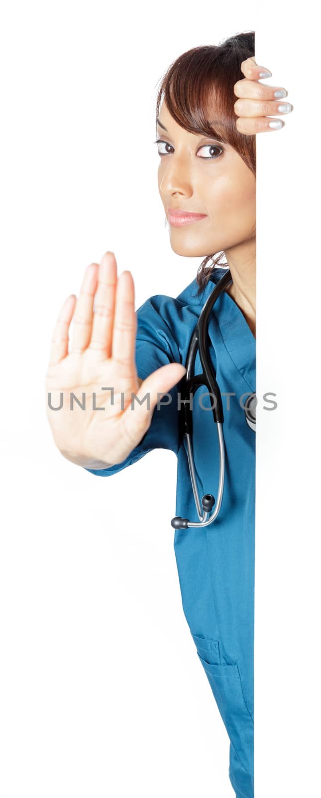 Attractive Indian doctor woman posing in a studio in front of a background