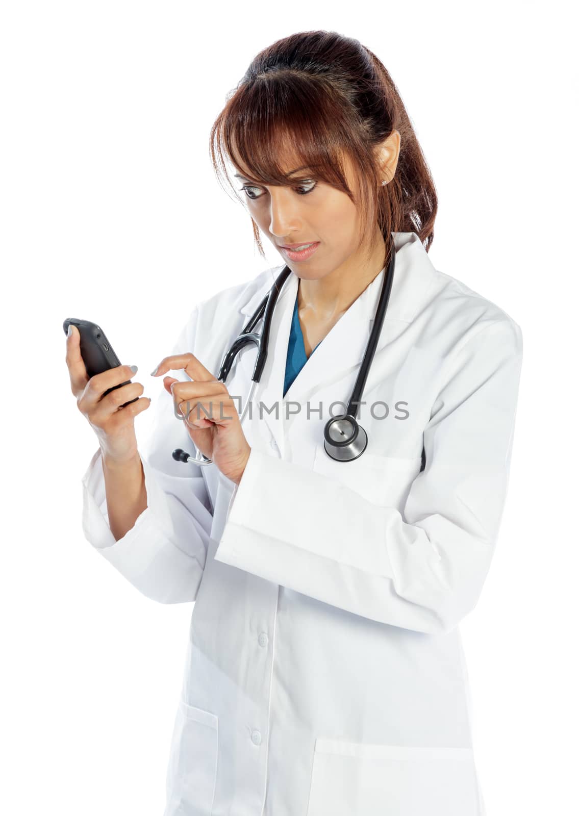 Attractive Indian doctor woman posing in a studio in front of a background