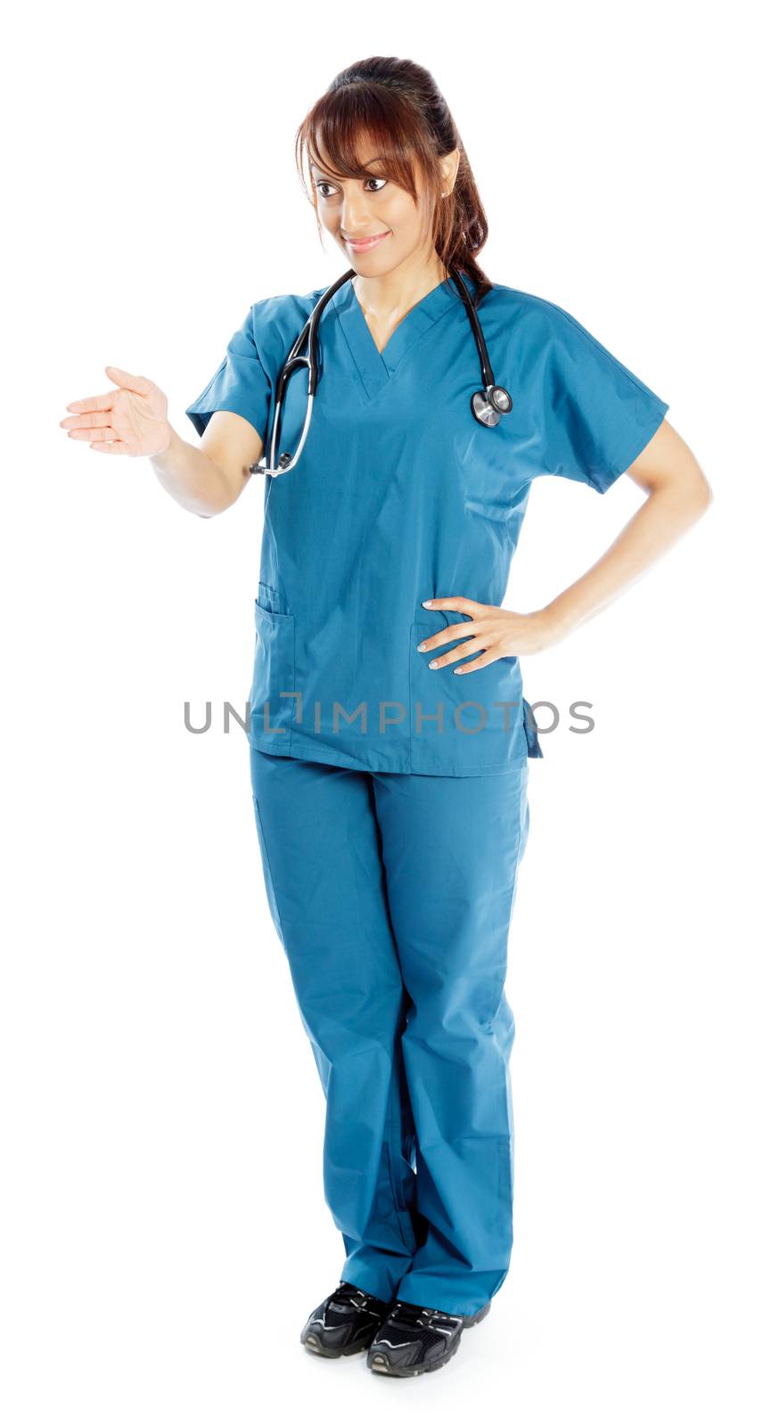 Attractive Indian doctor woman posing in a studio in front of a background