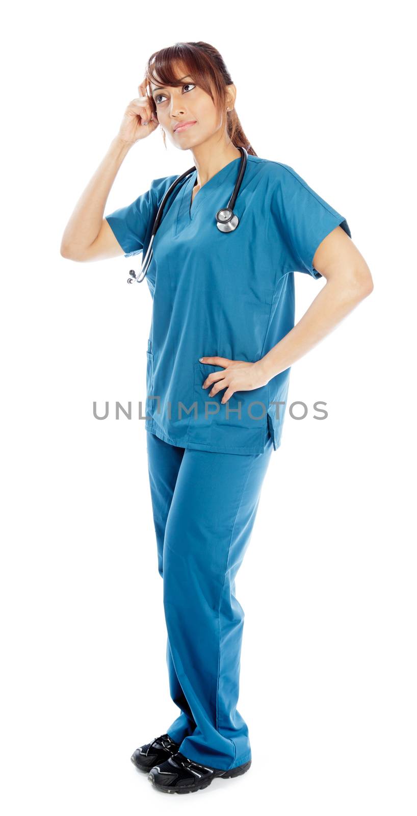 Attractive Indian doctor woman posing in a studio in front of a background