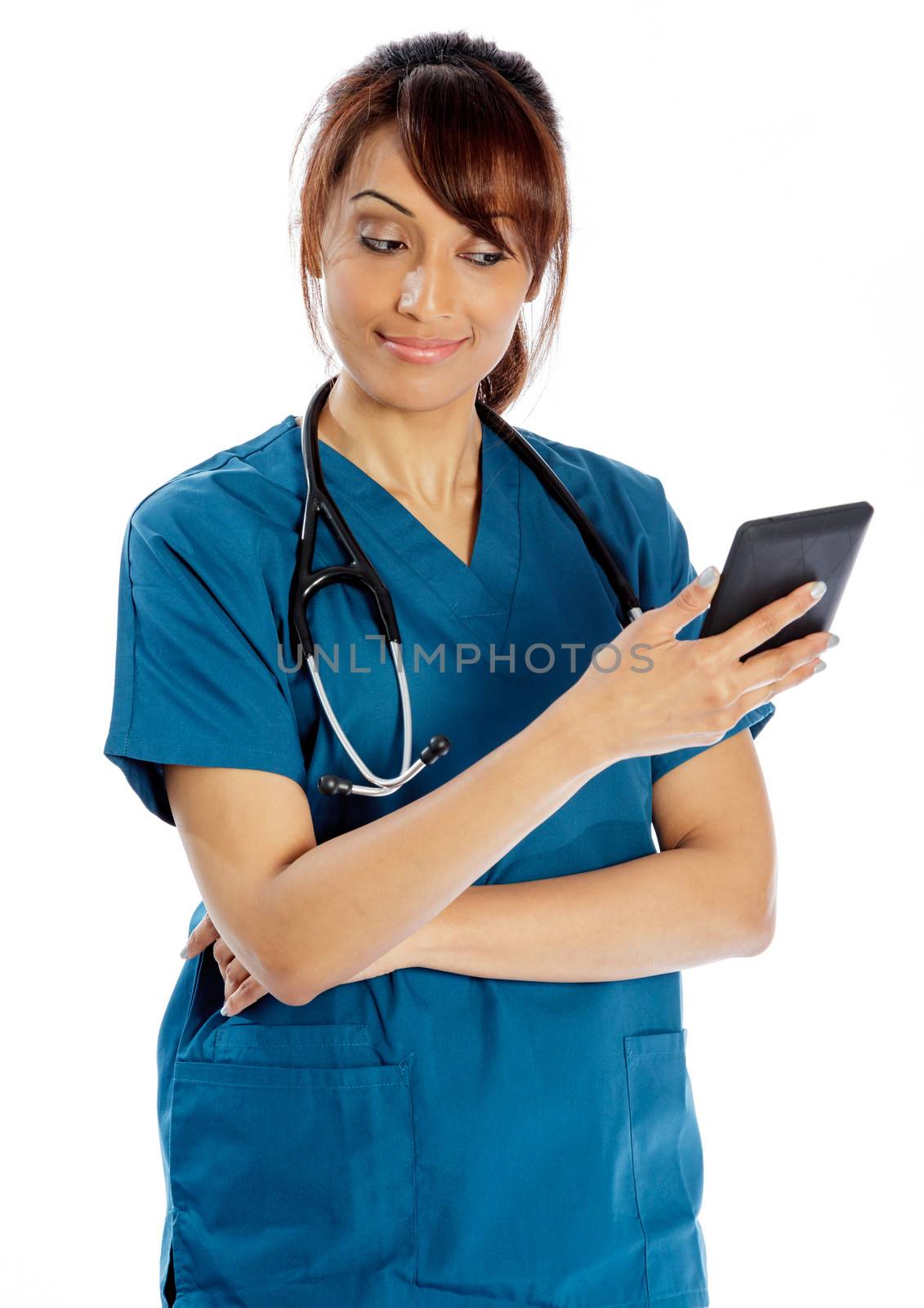 Attractive Indian doctor woman posing in a studio in front of a background