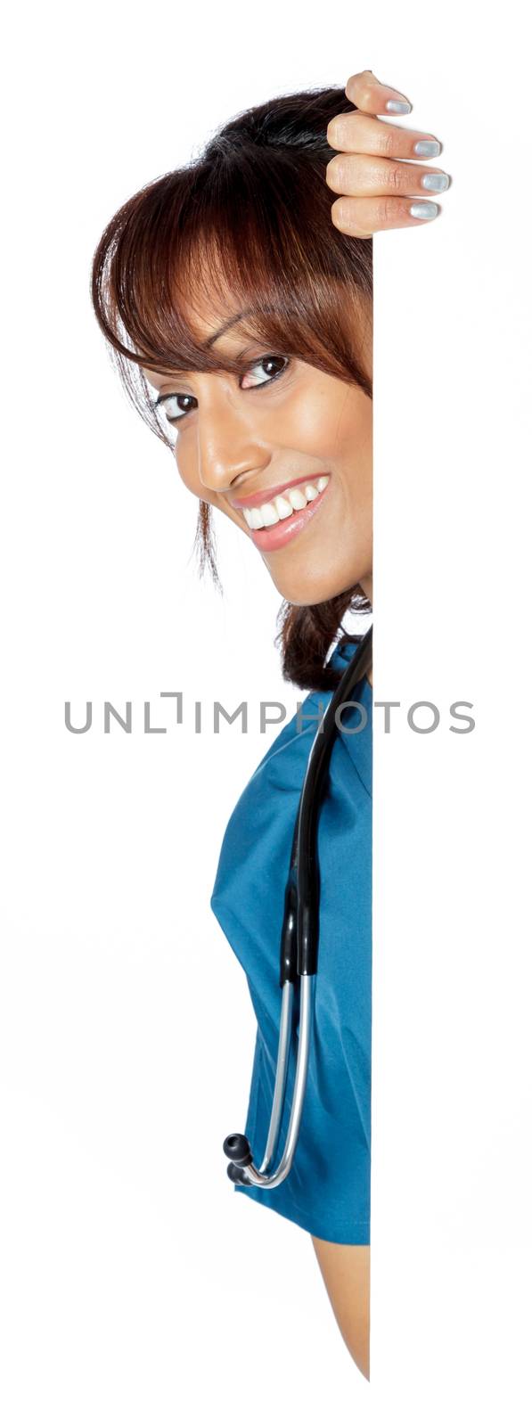 Attractive Indian doctor woman posing in a studio in front of a background