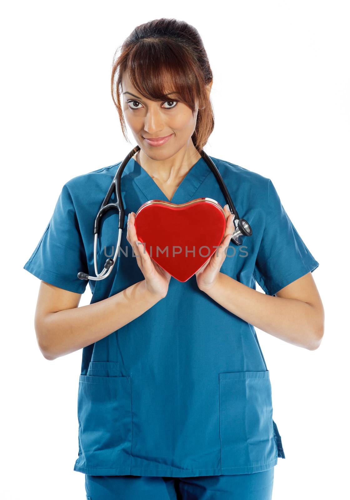 Attractive Indian doctor woman posing in a studio in front of a background