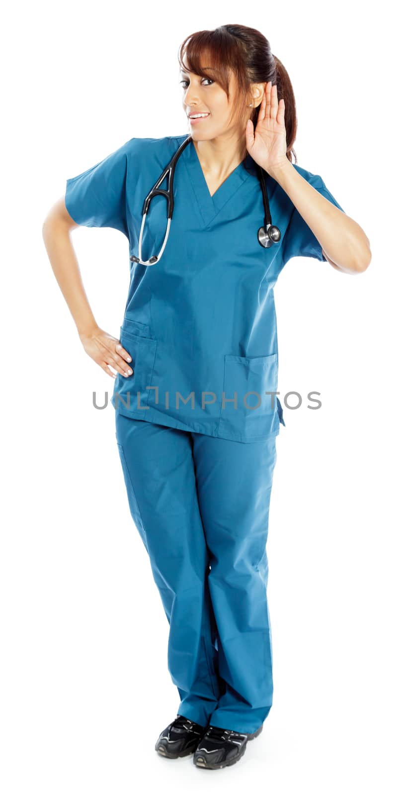 Attractive Indian doctor woman posing in a studio in front of a background