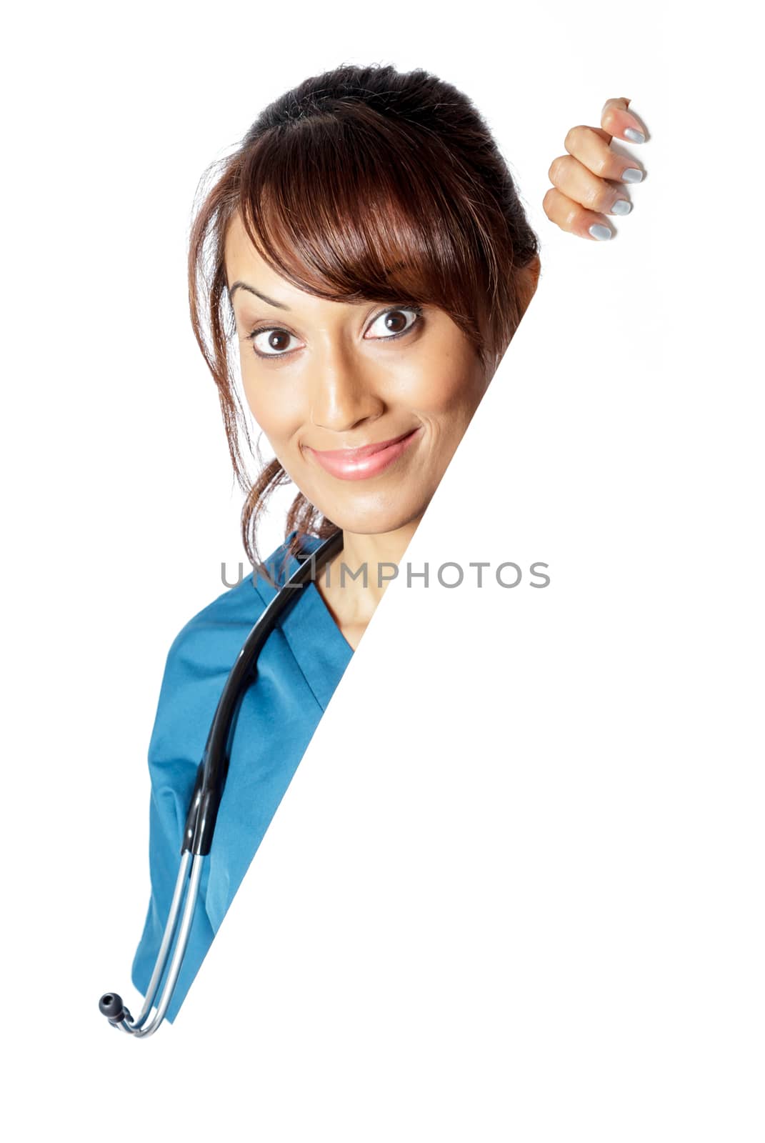 Attractive Indian doctor woman posing in a studio in front of a background