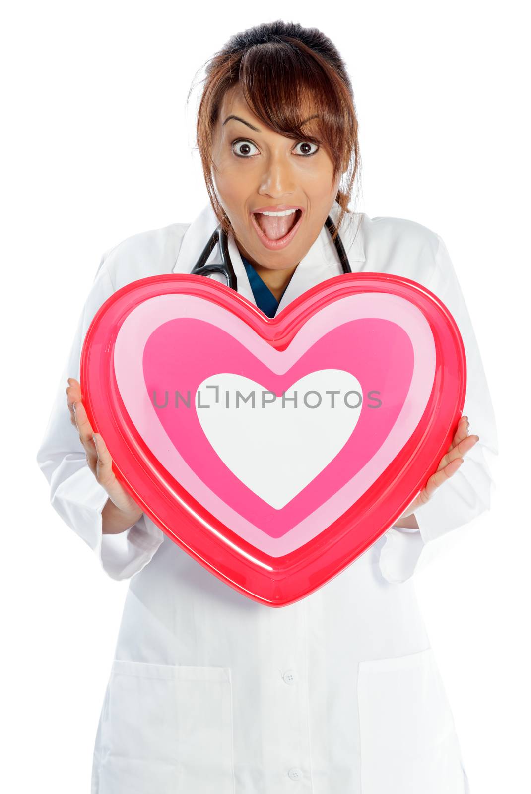 Attractive Indian doctor woman posing in a studio in front of a background