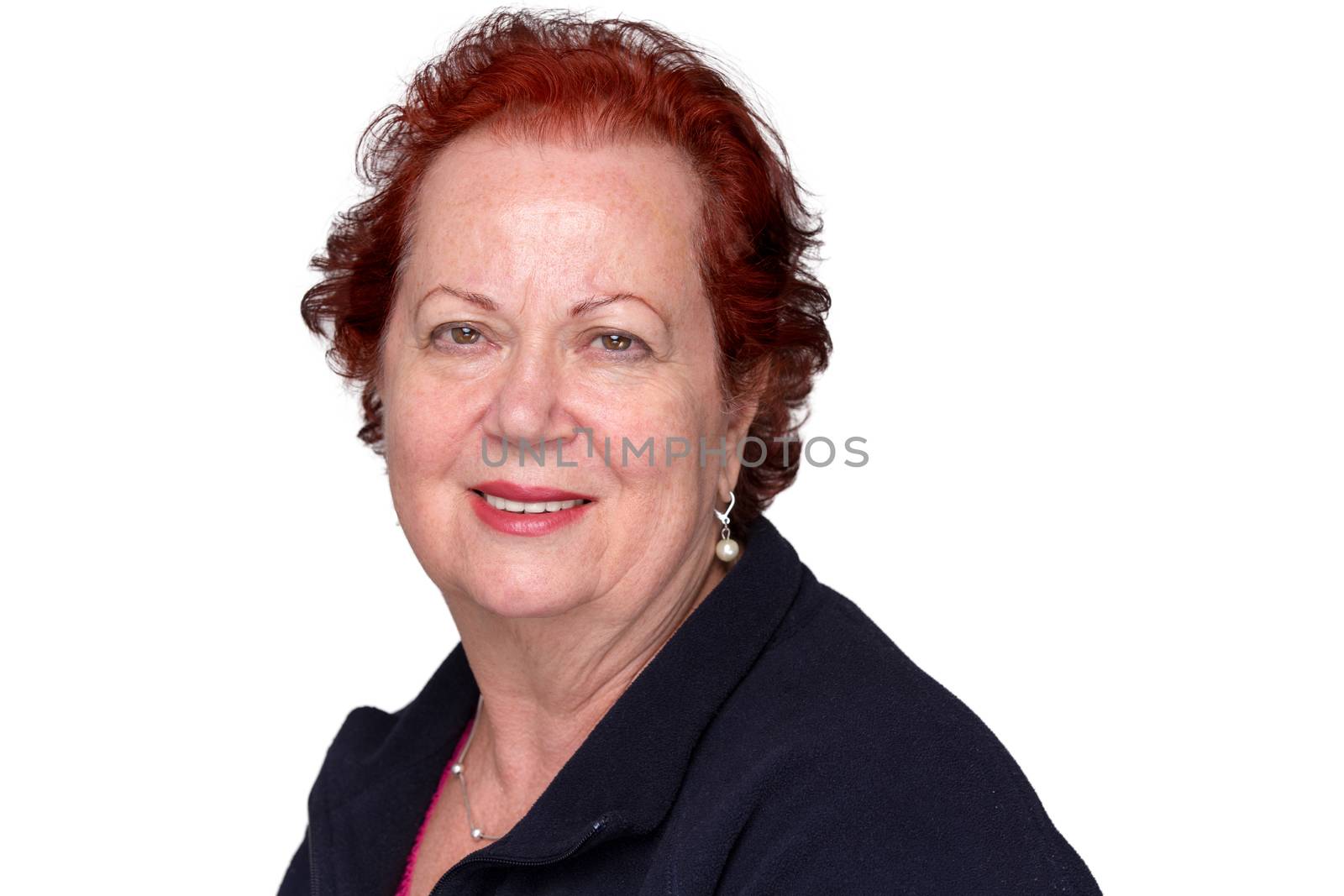 Red hair senior lady looking at camera trustfully