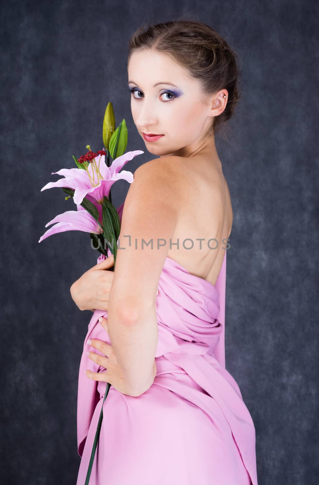 girl in an old garment with a pink flower