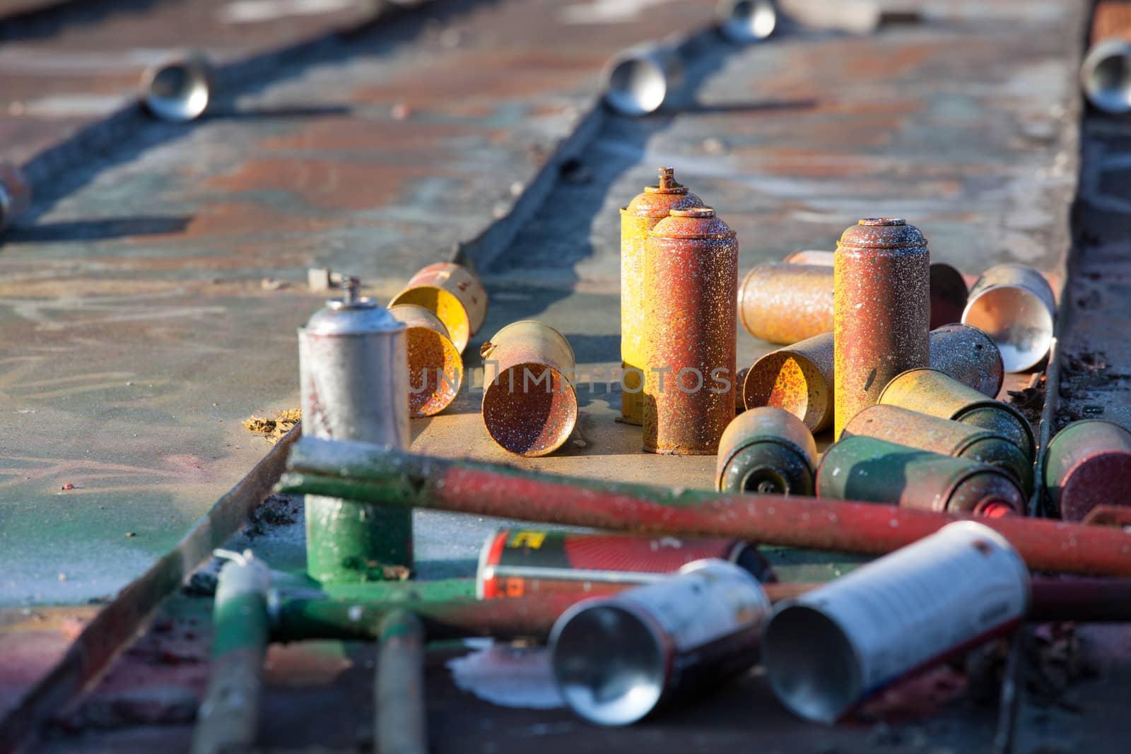 Used spray cans in a roof by juhku