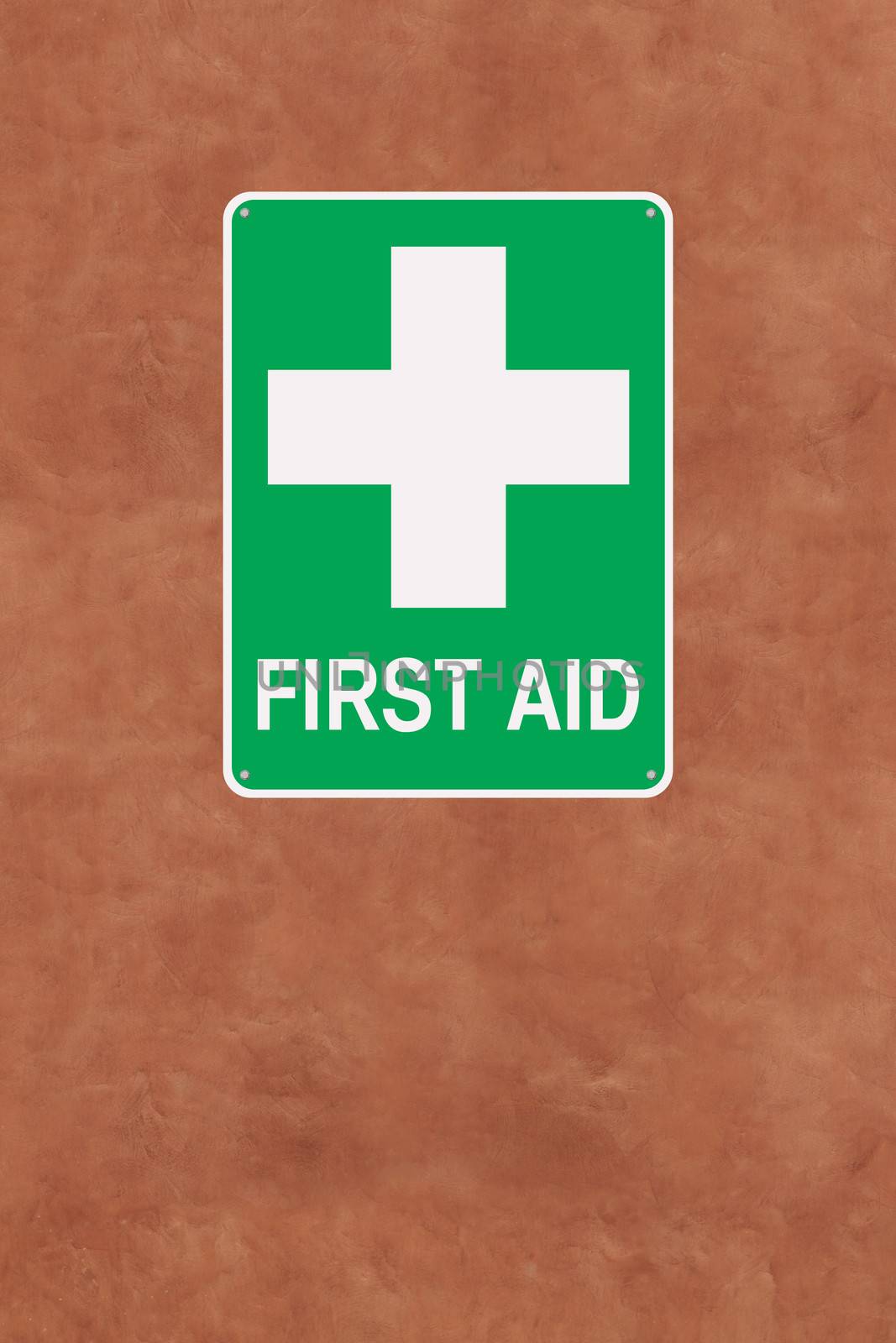 A first aid sign mounted on a wall