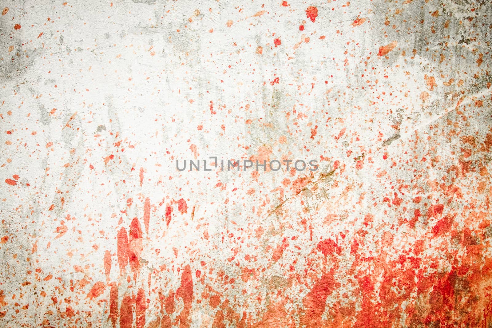 White concrete wall with blood splatters on the sides