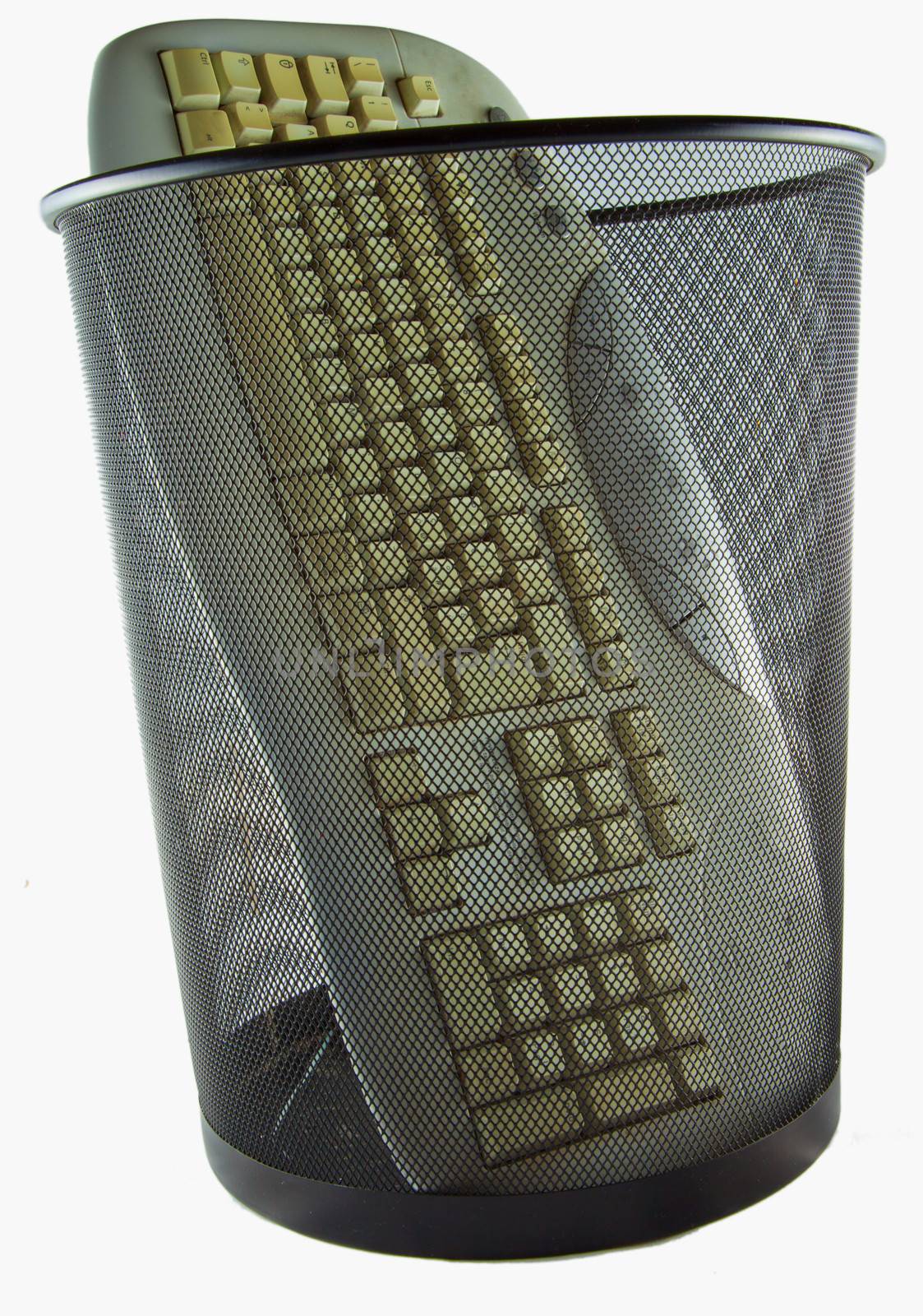 Keyboard for pc in a black trash can, isolated over white