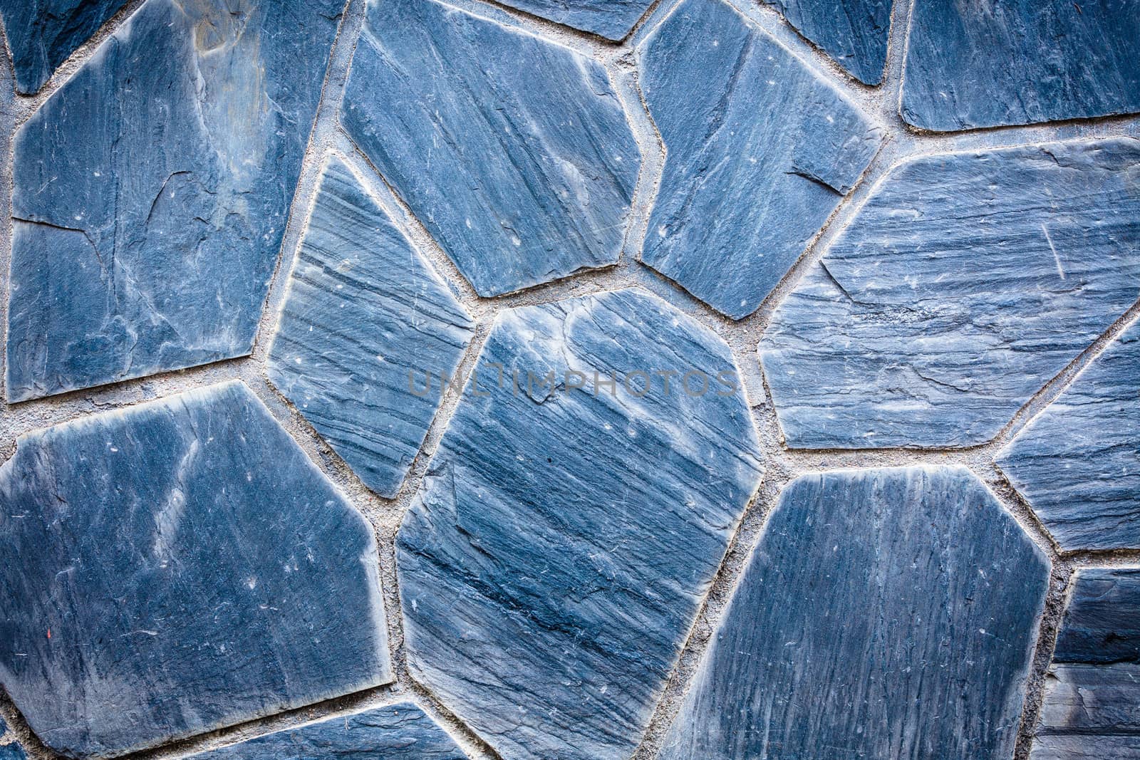 Blue stones from a buildings wall by juhku