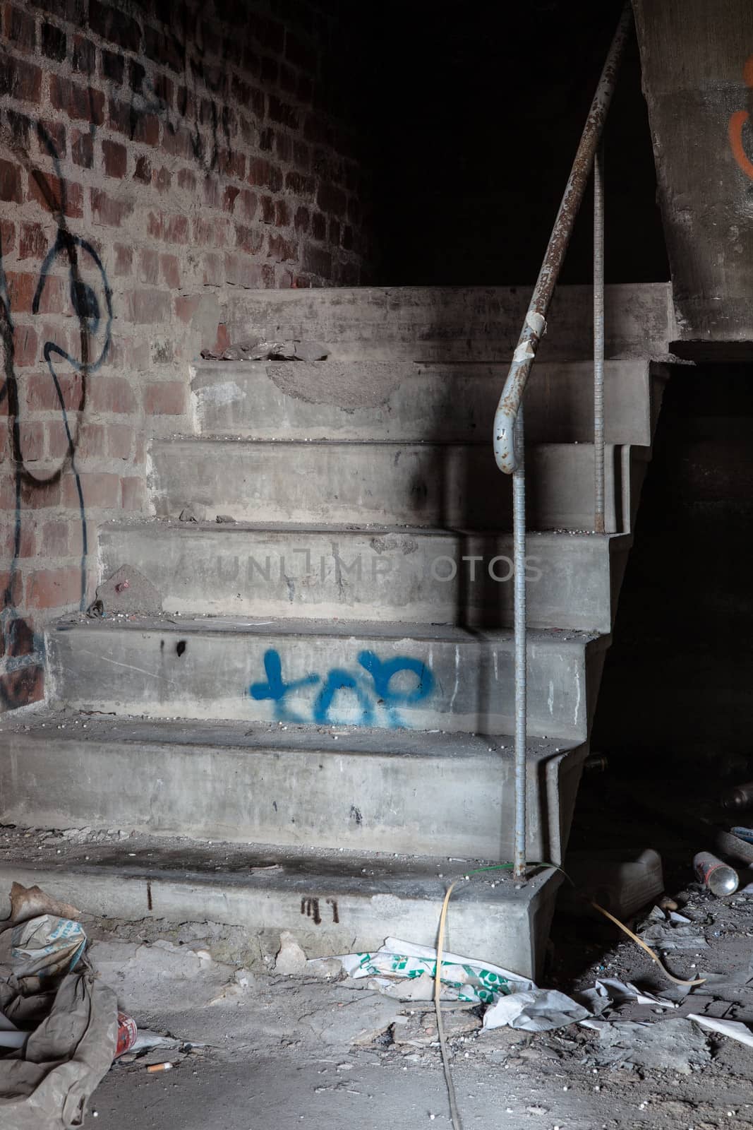 Creepy staircase in abandoned warehouse by juhku