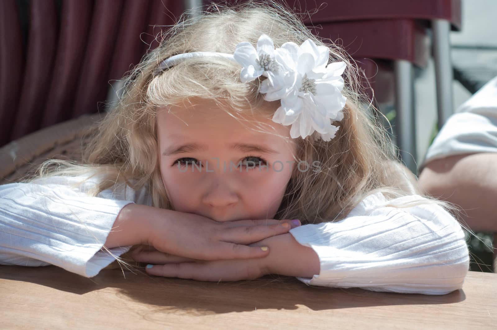 Beautiful girl sitting on the table by anytka