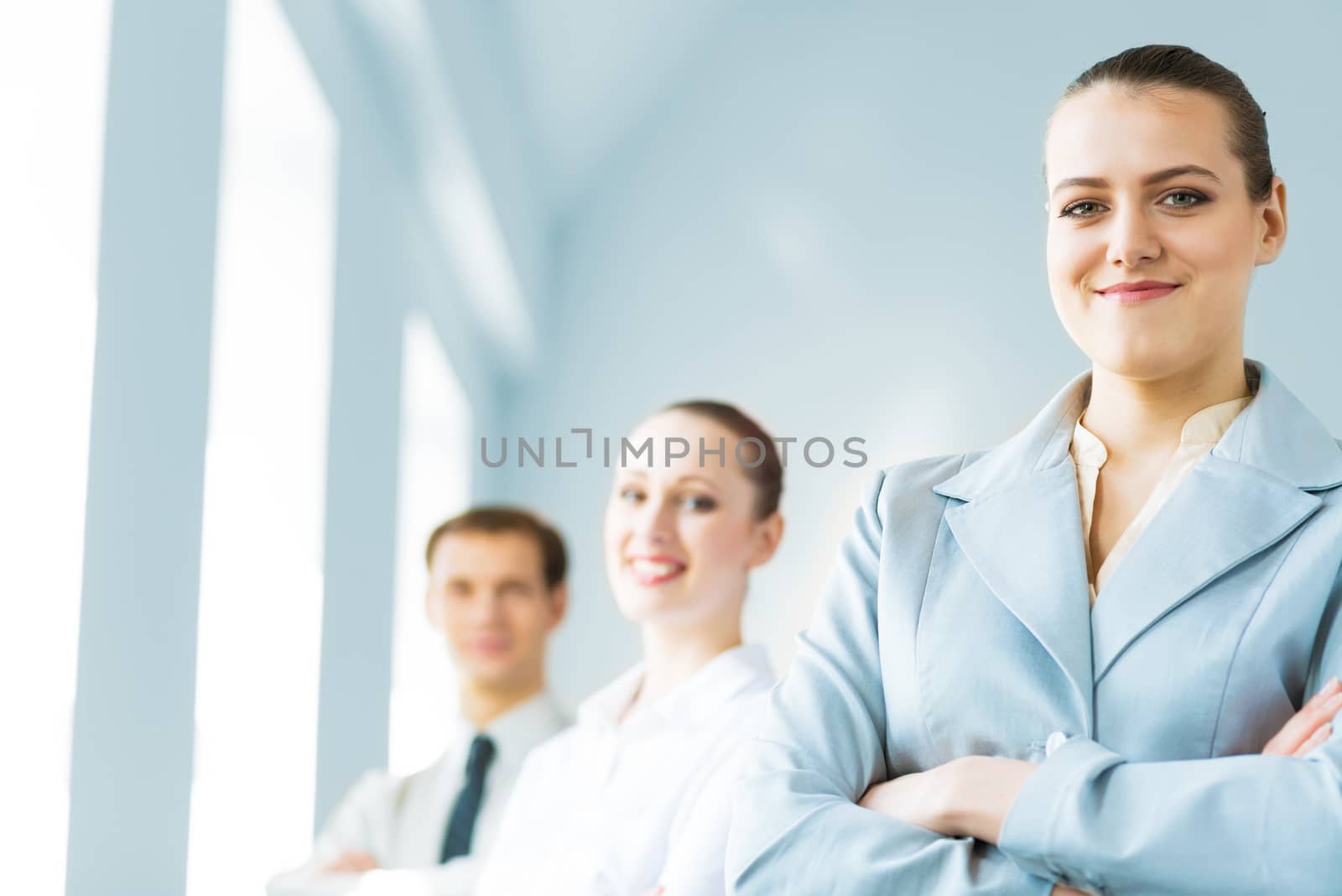 successful businessmen, a portrait of a business woman standing next to colleagues