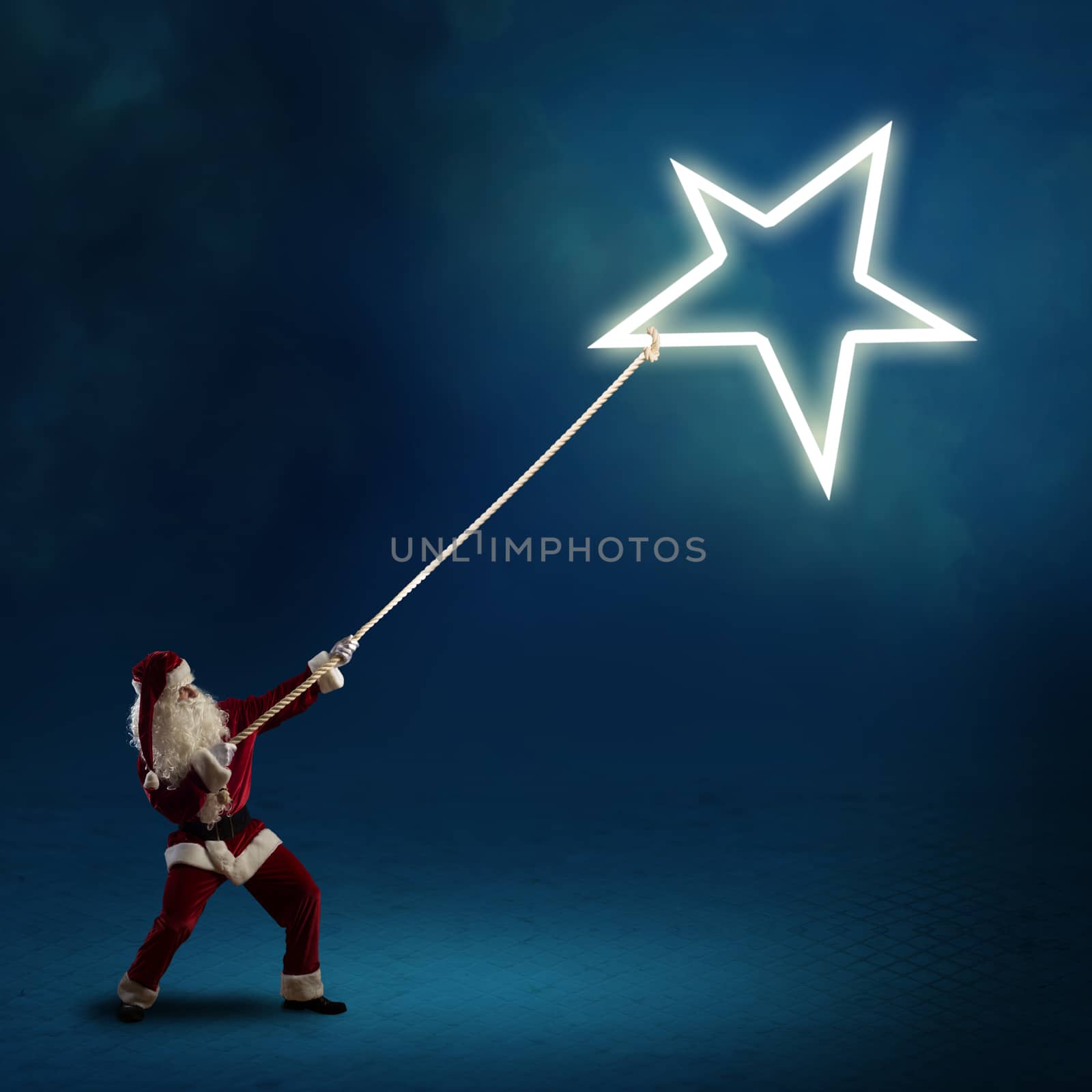 Santa Claus pulls the shining star using a rope