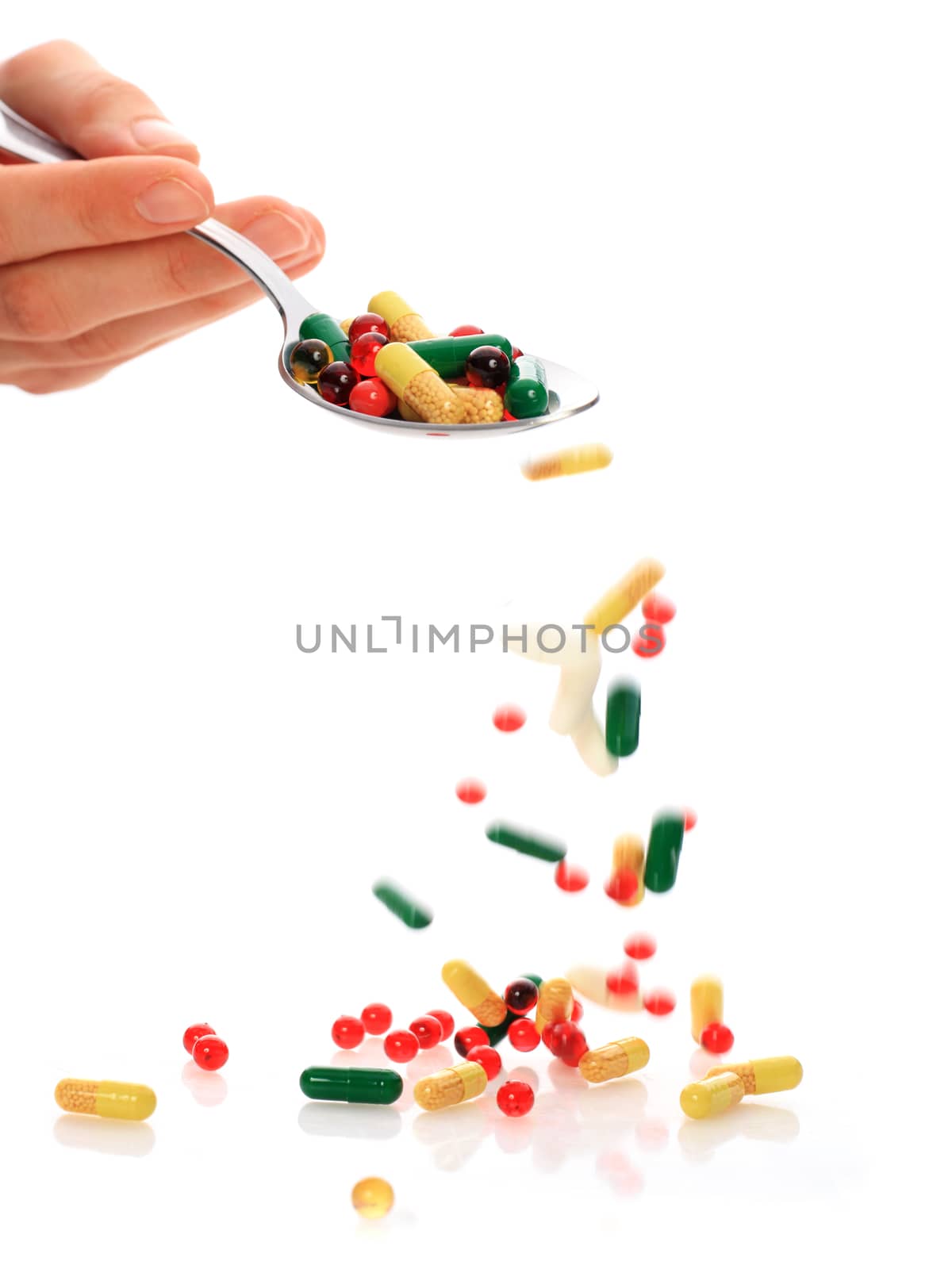 Colorful pills isolated over white.