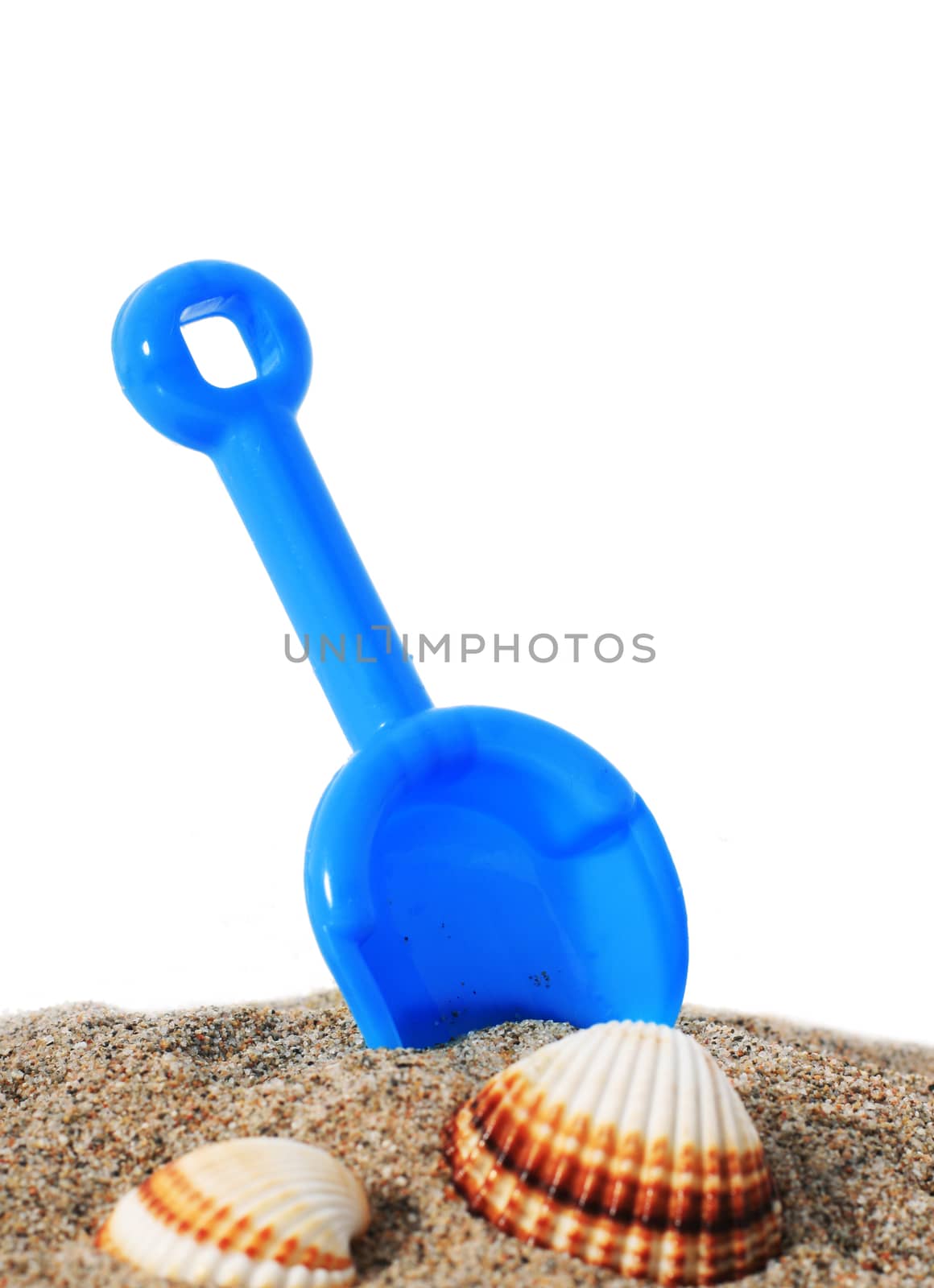 Toys and sand isolated over white.