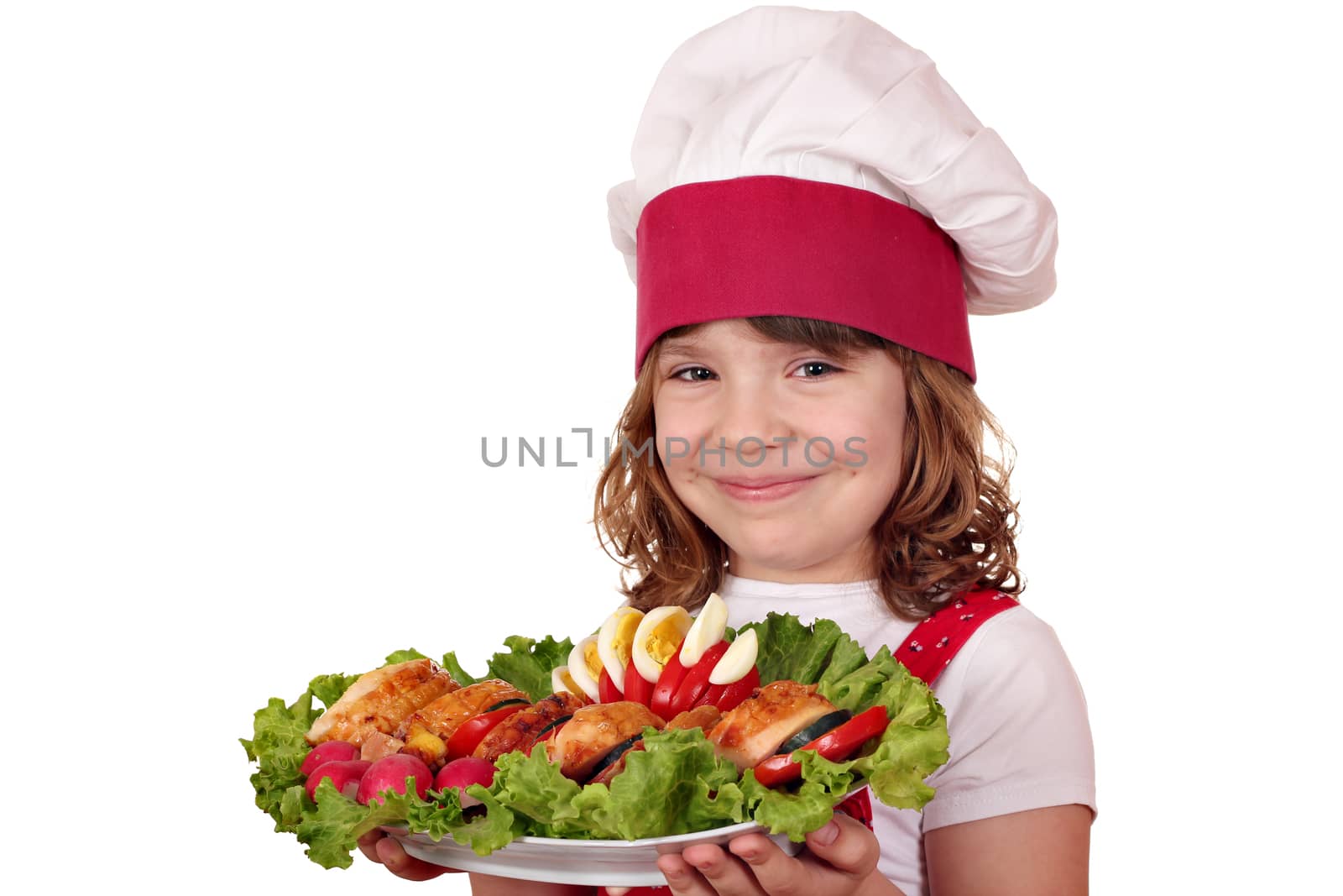 beautiful little girl cook with roasted chicken meat and salad