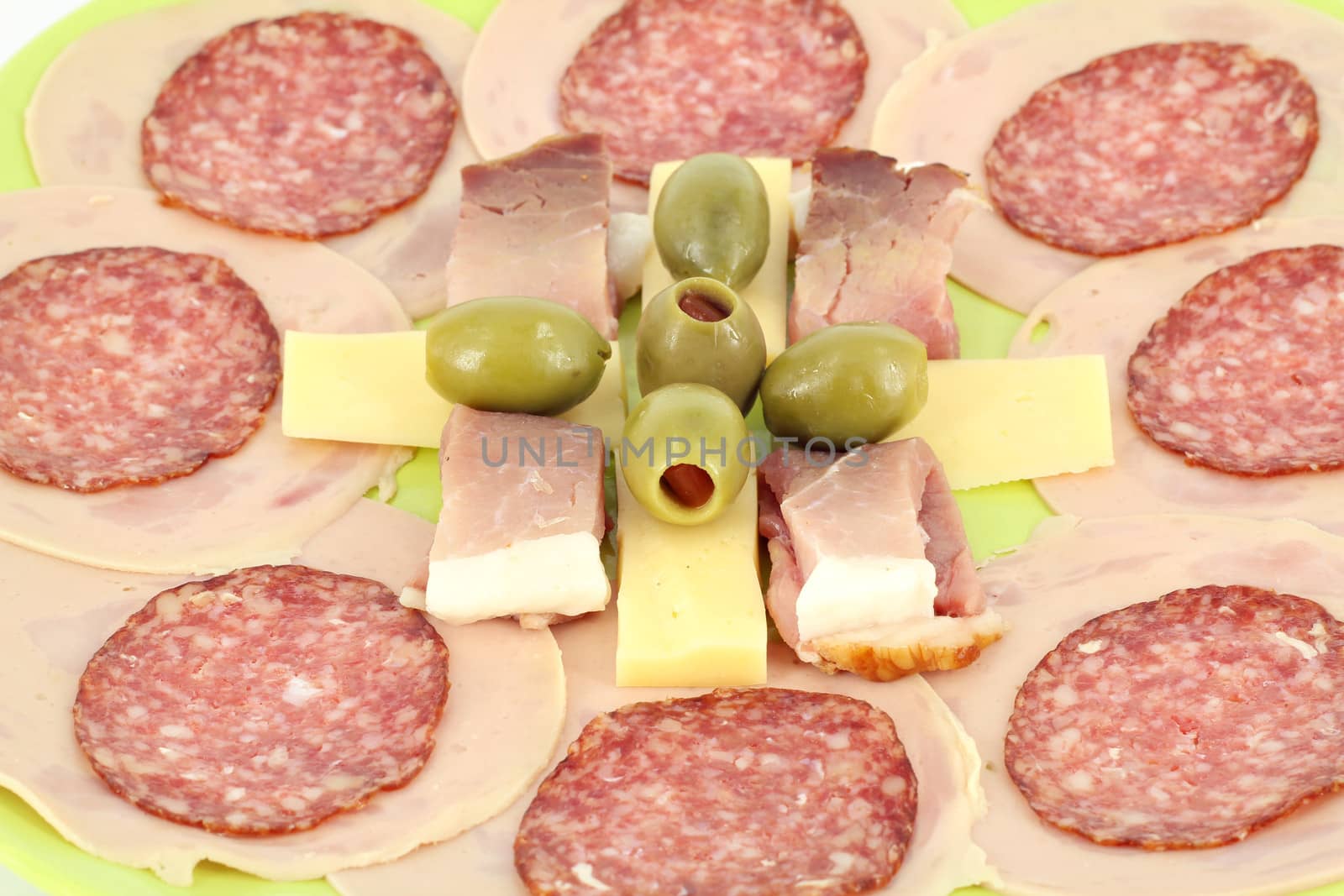 ham salami cheese and olives food background 