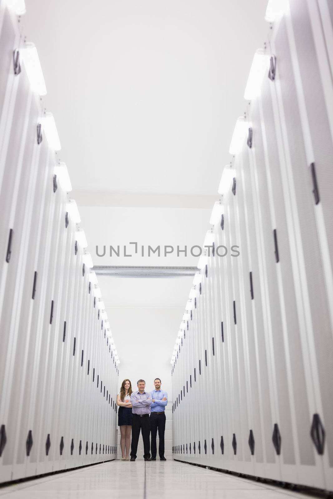 Technicians standing at end of hallway by Wavebreakmedia