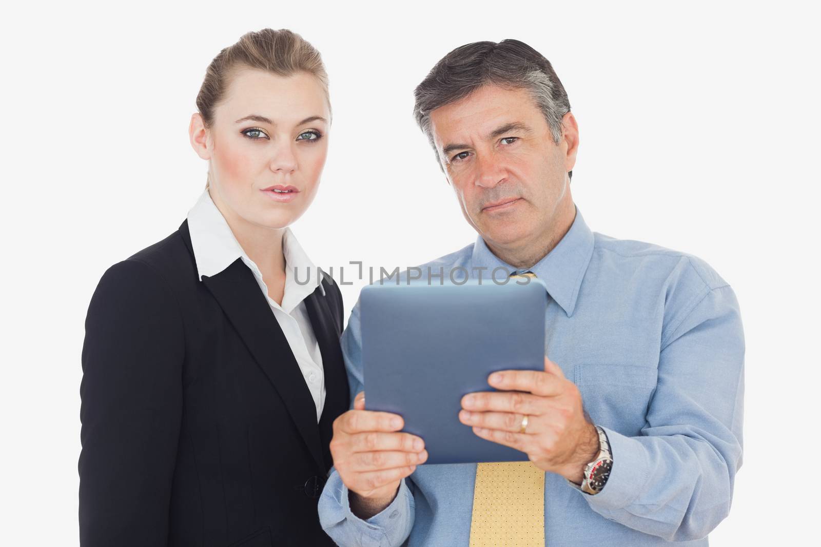 Serious business people with digital table against white background