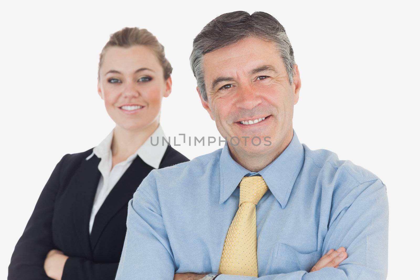 Portrait of happy business people with arms crossed isolated over white background