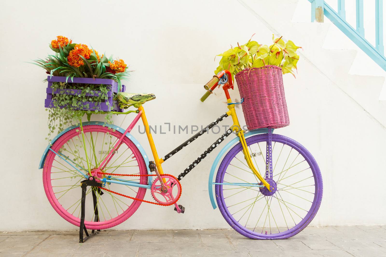 Colorful bicycles with bunches of flowers