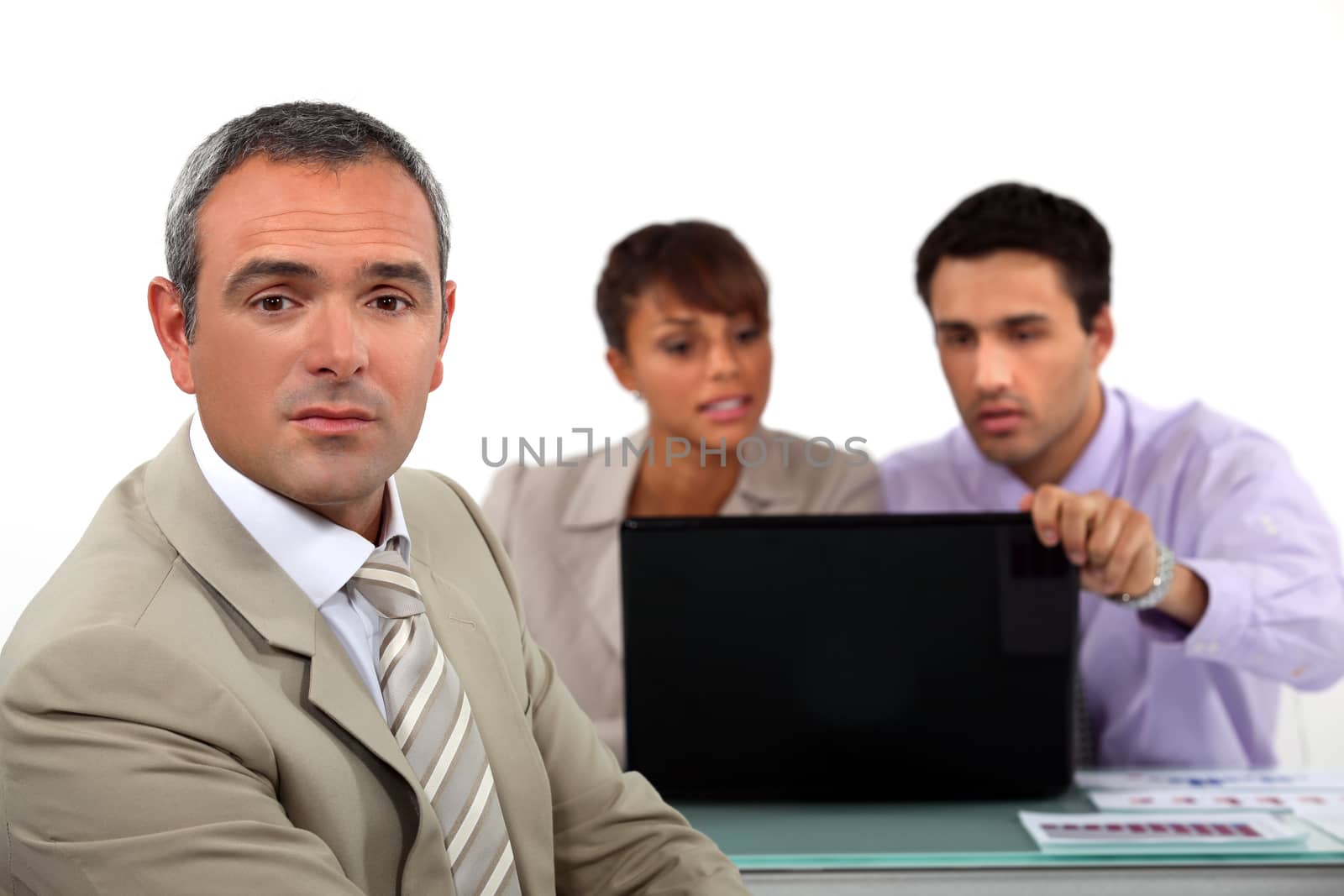 Business people with a laptop by phovoir