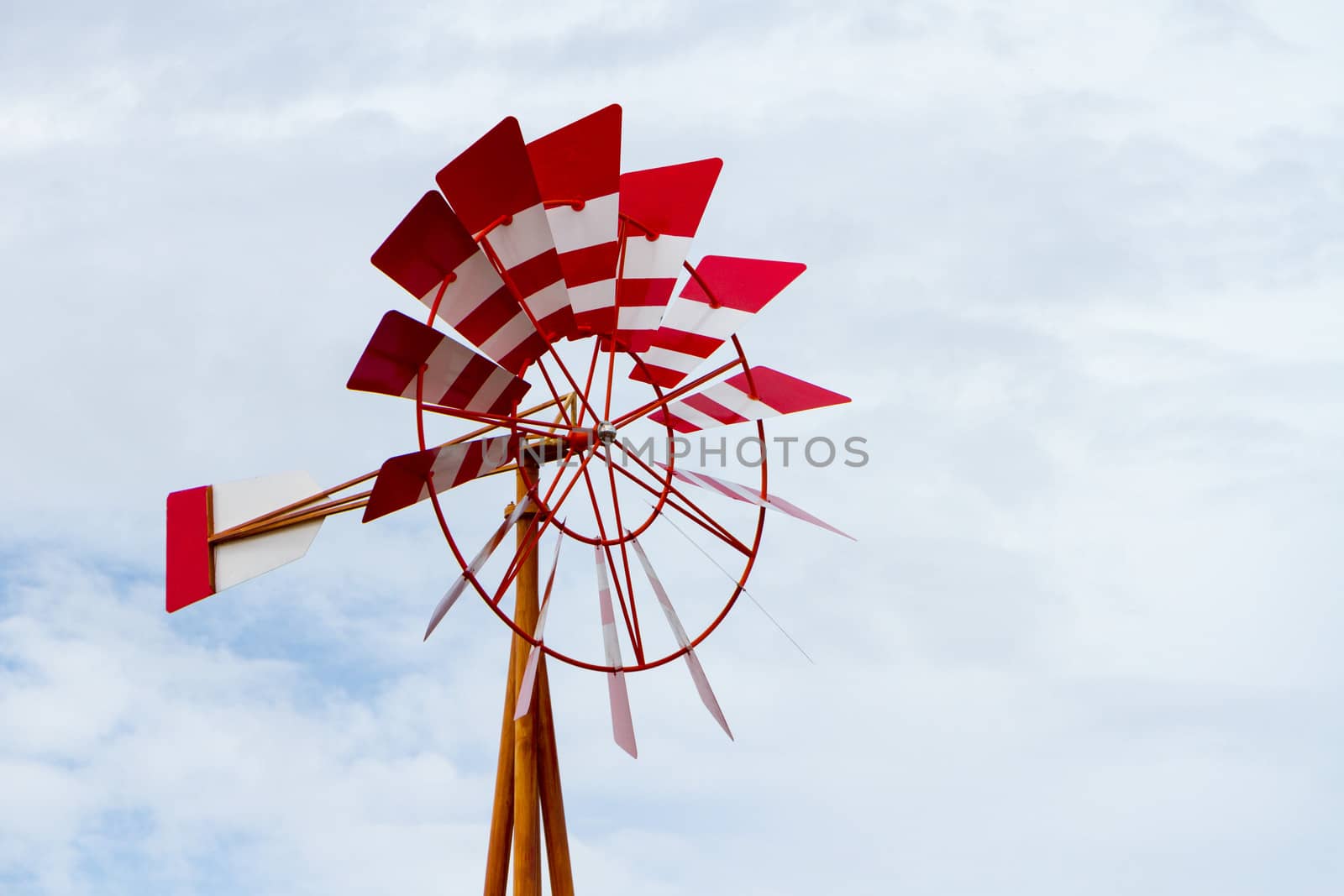 red windmill on blue sky