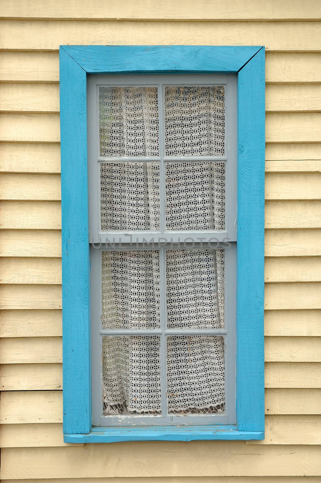 Wooden wall with window and curtain