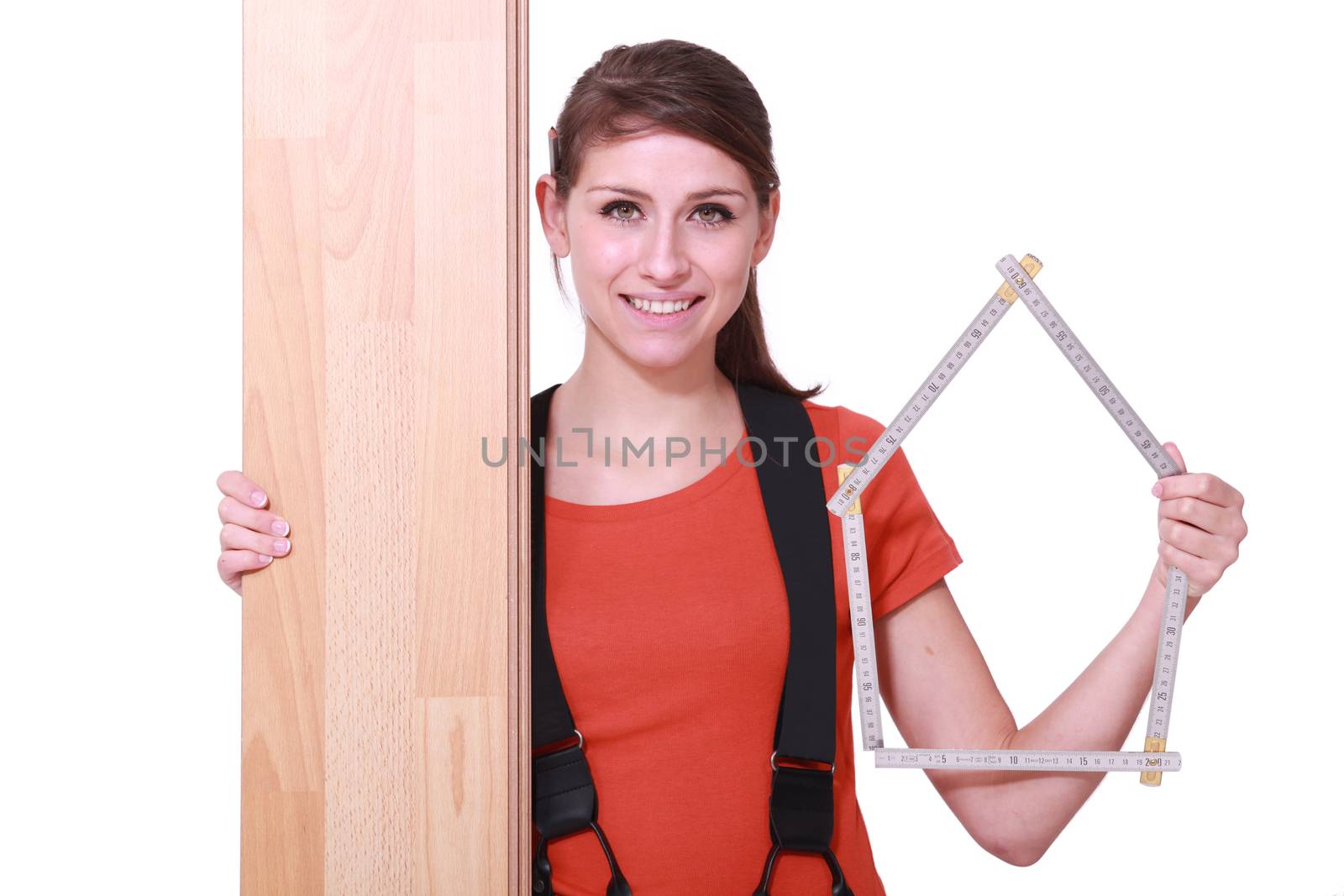 Woman stood with laminate flooring by phovoir