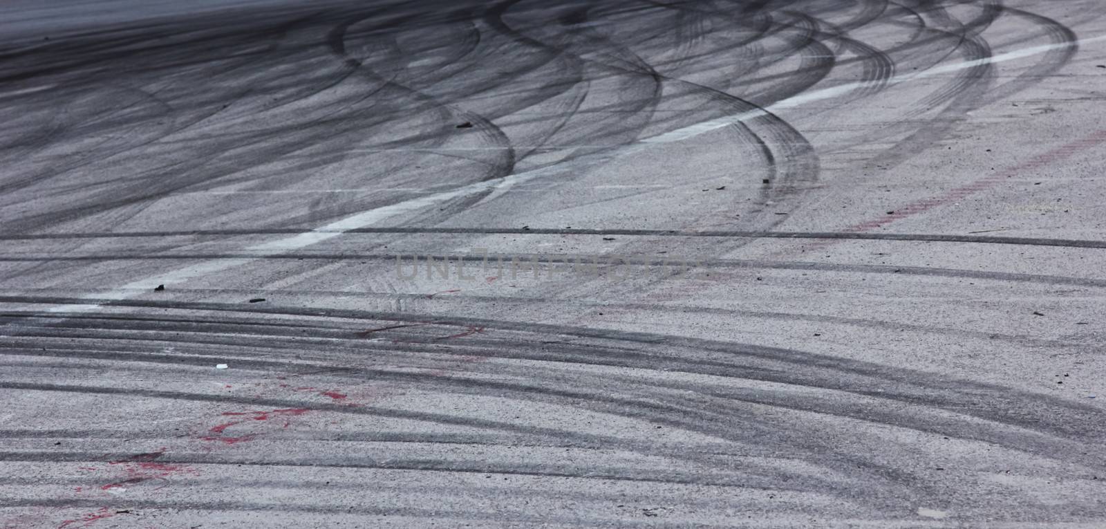 Background with tire marks on road track