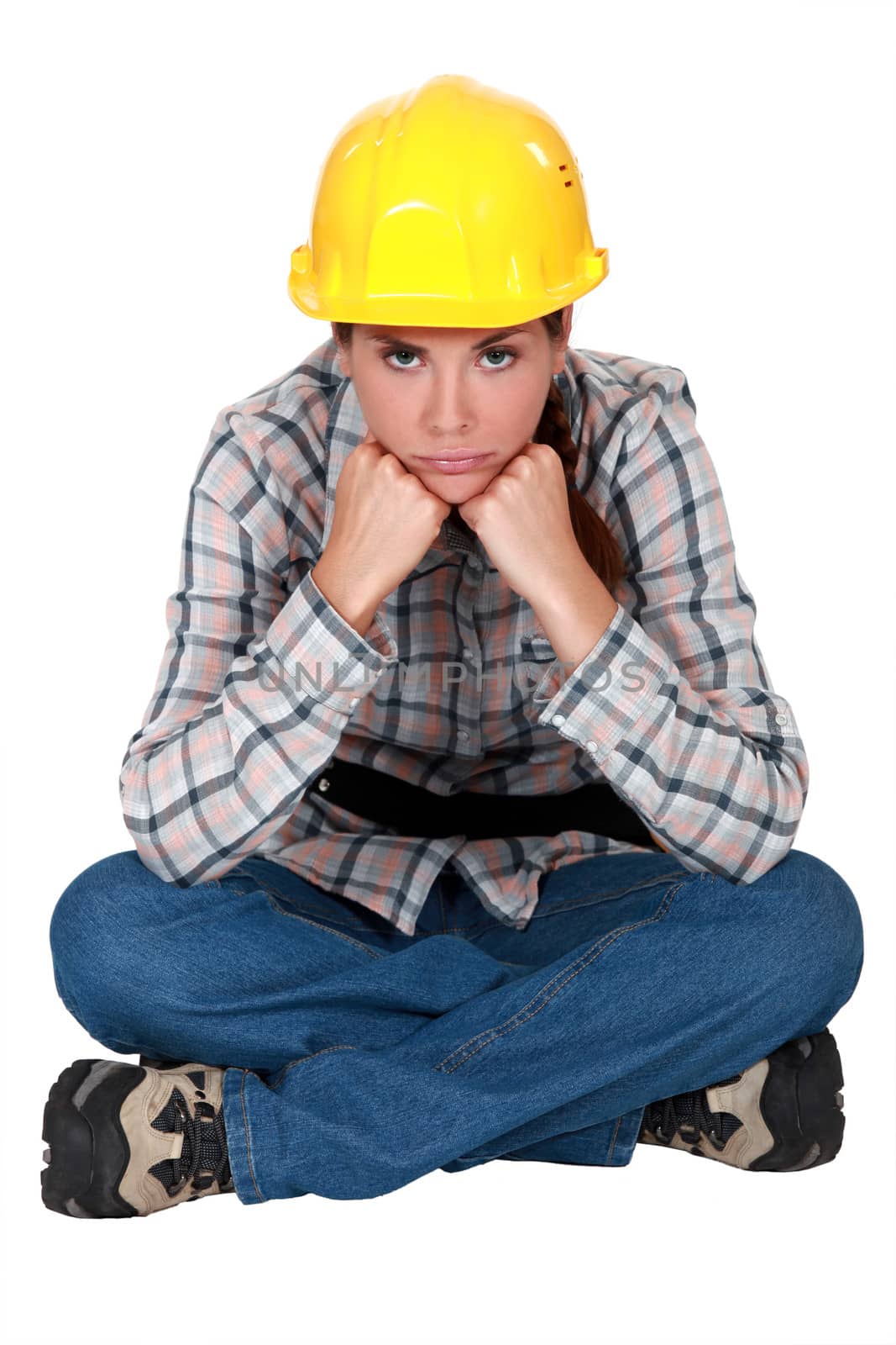 Gloomy female construction worker by phovoir