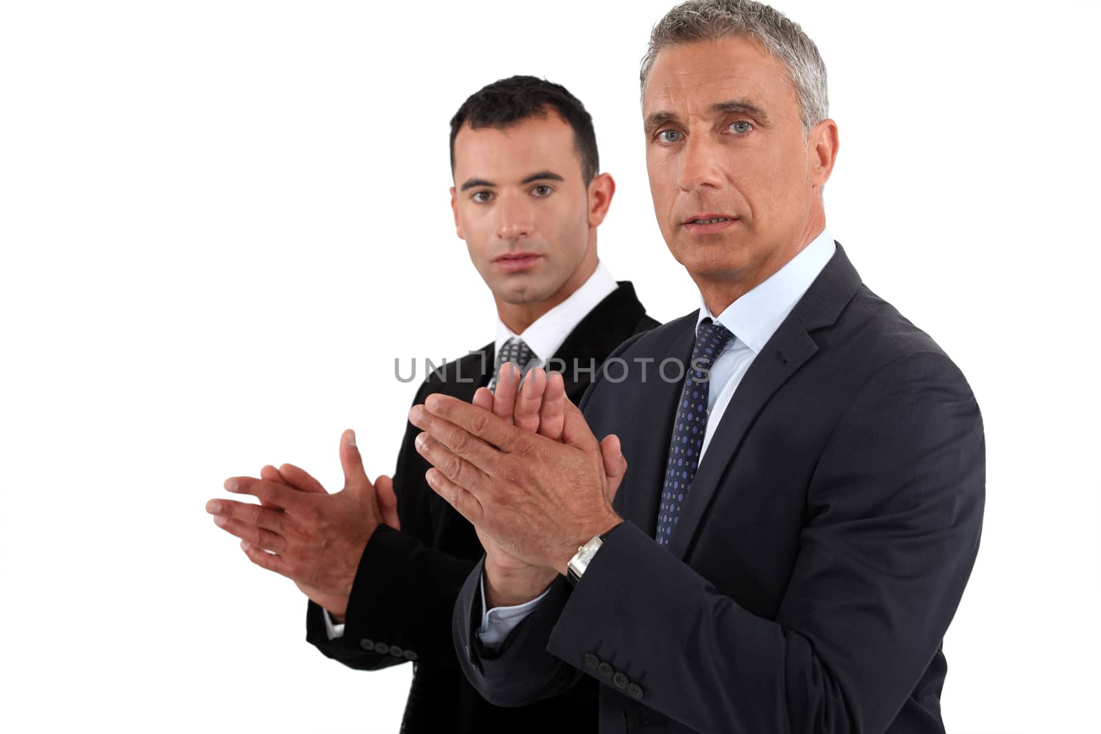 Businessmen clapping their hands