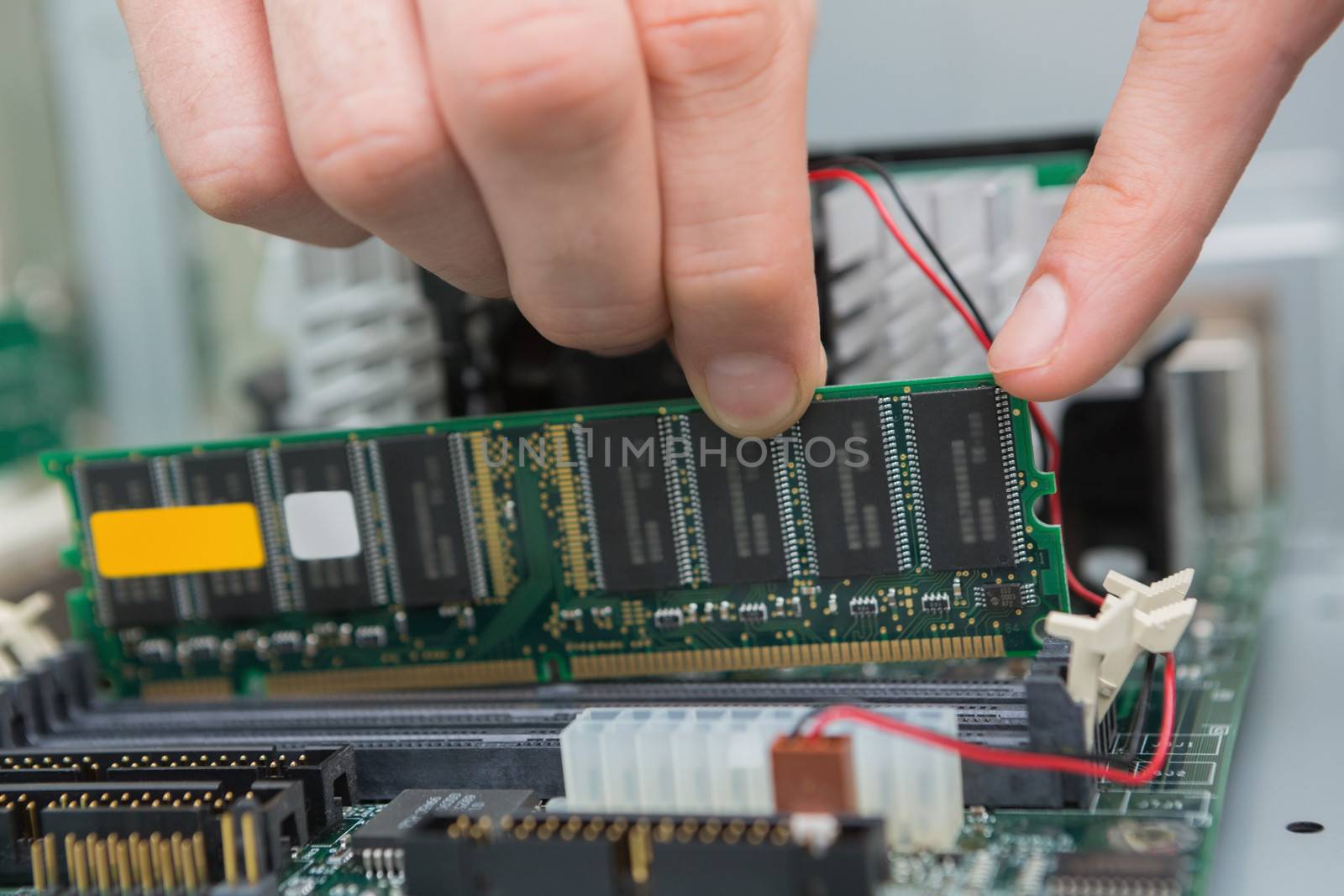 Hand fixing ram by Wavebreakmedia