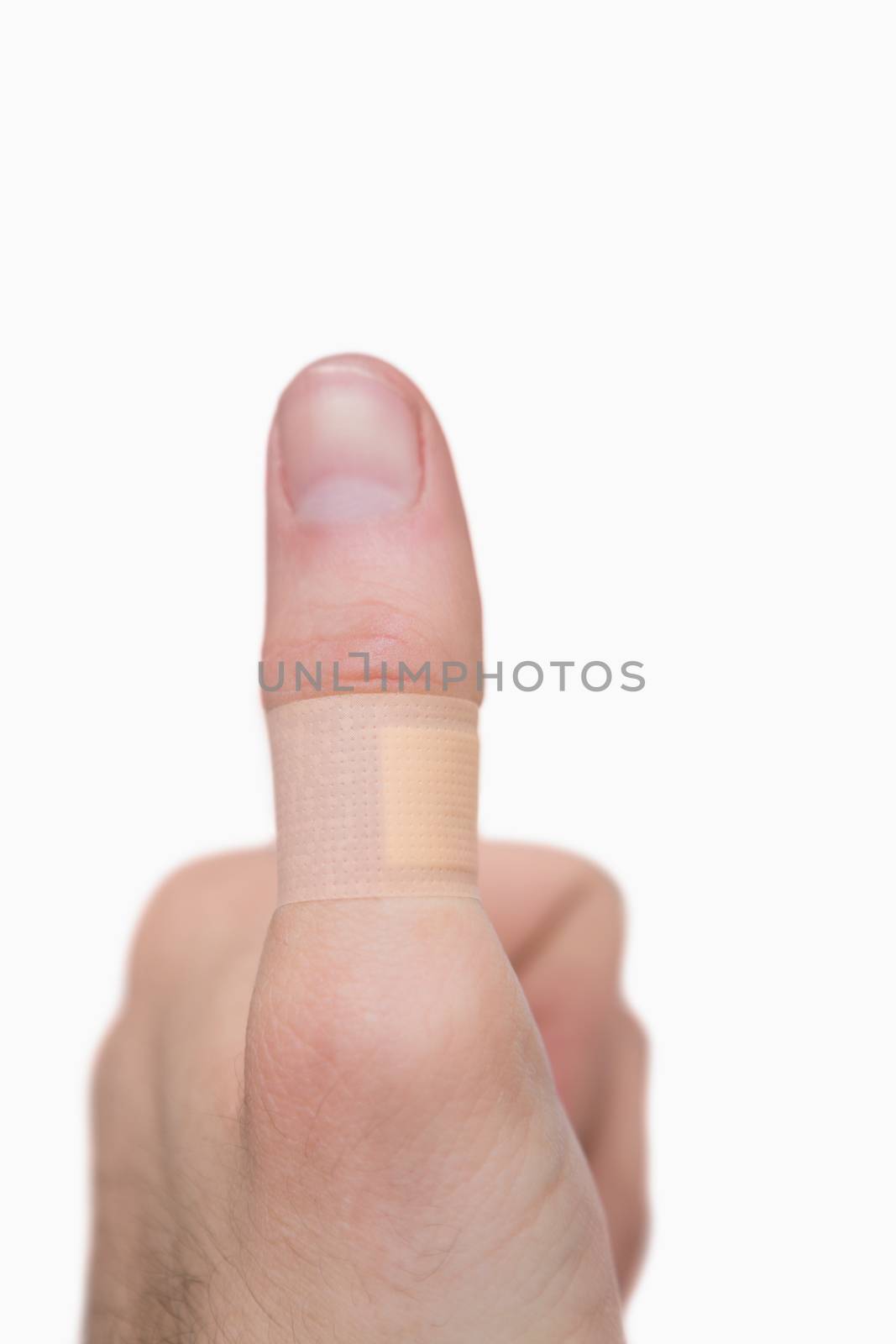 Closeup of thumbs up sign by Wavebreakmedia