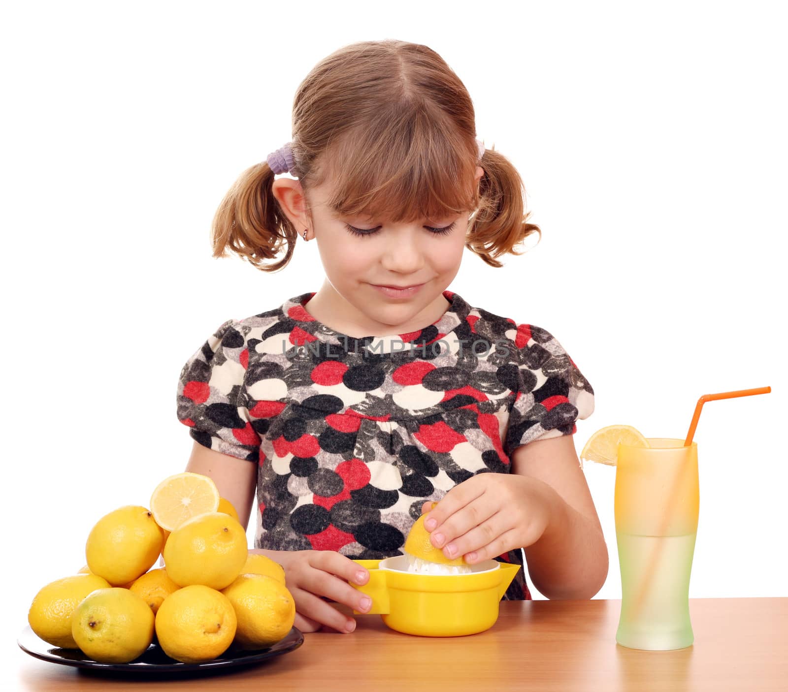 beautiful little girl make lemonade by goce