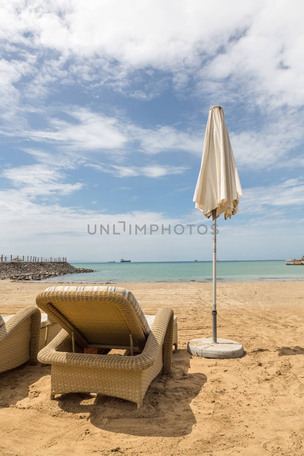 Beach chairs on a beautiful sunny day overlooking the beach on the Red sea