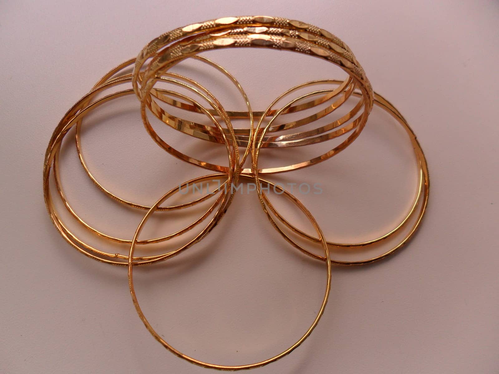 women's jewelry in the form of shiny metal
rings and rose gold color