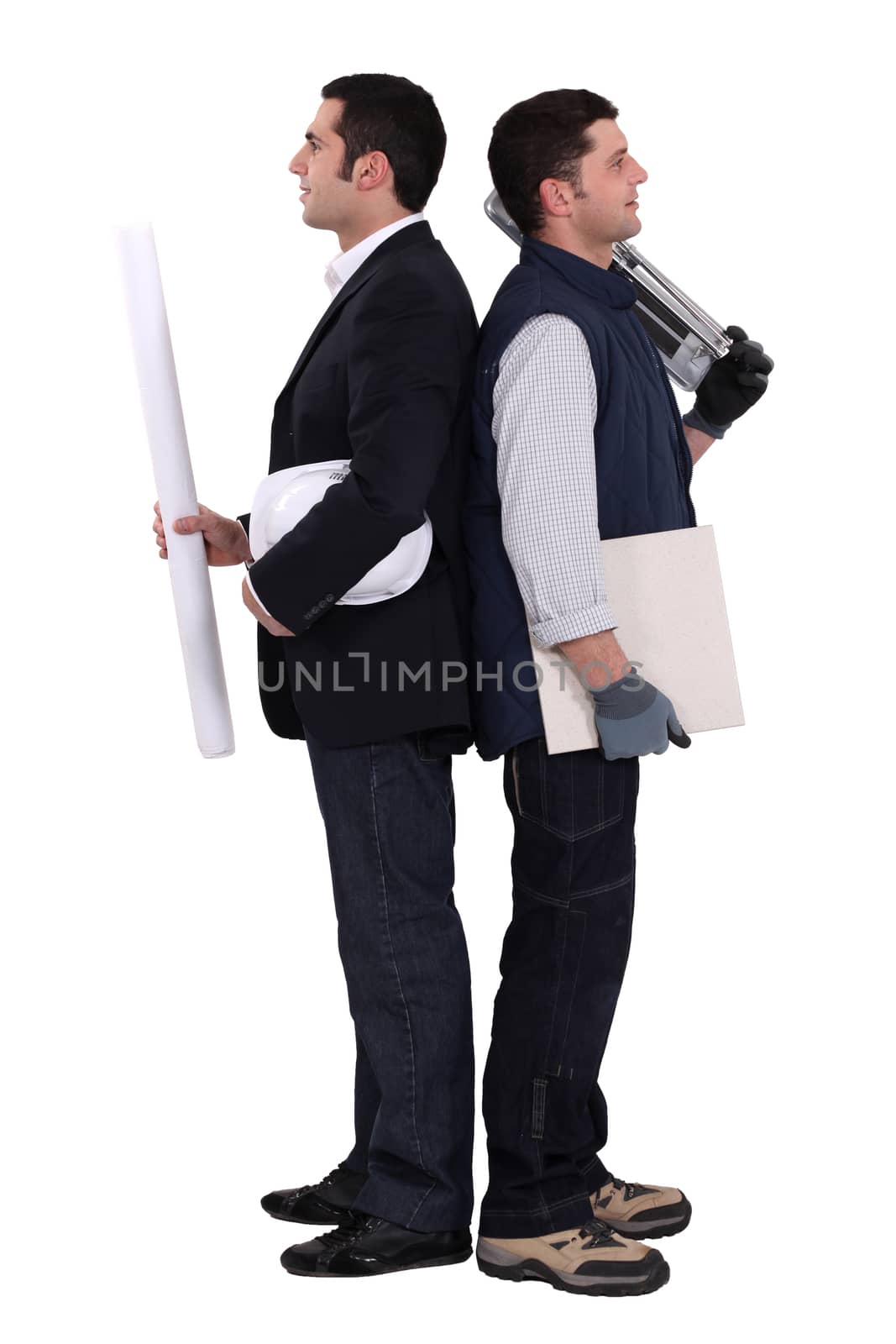 Construction worker and engineer standing back to back by phovoir