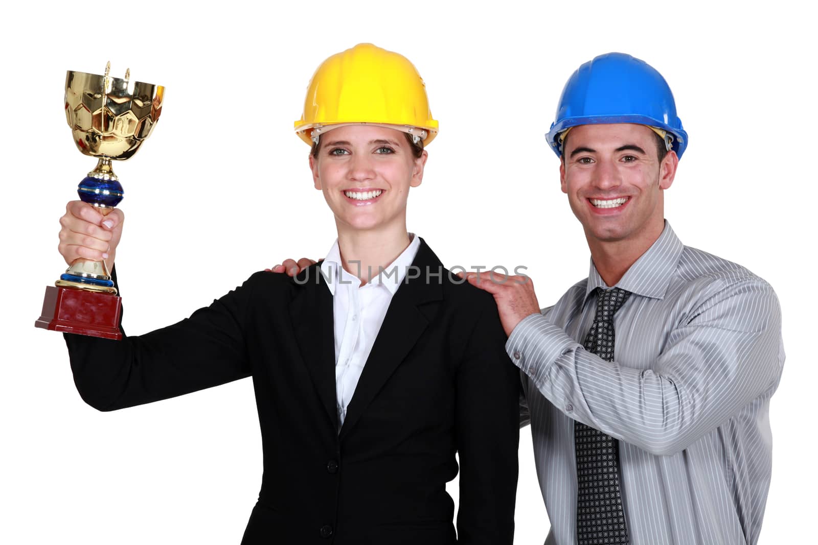 A couple of architects holding a trophy.