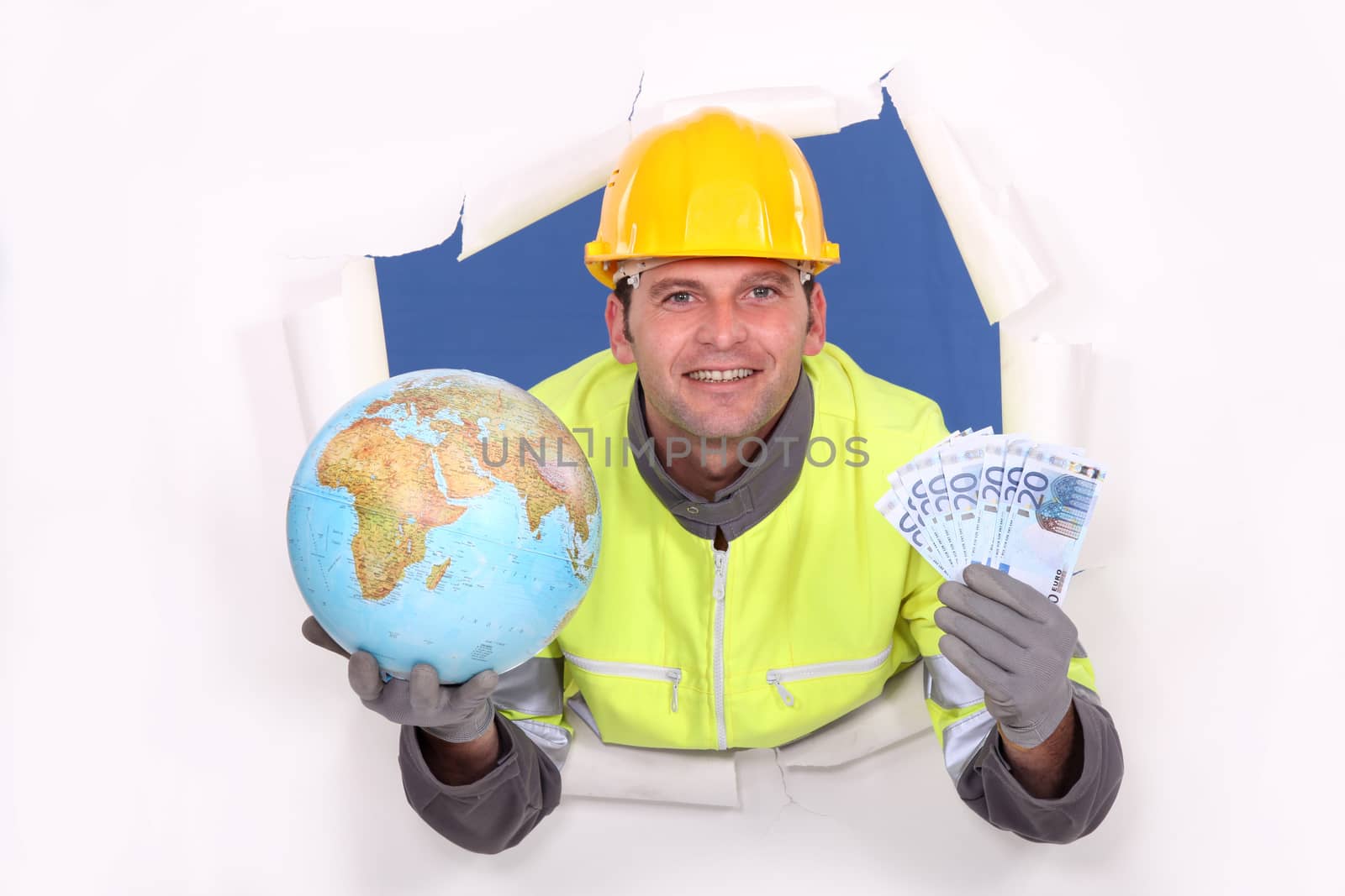 Worker holding a globe and money