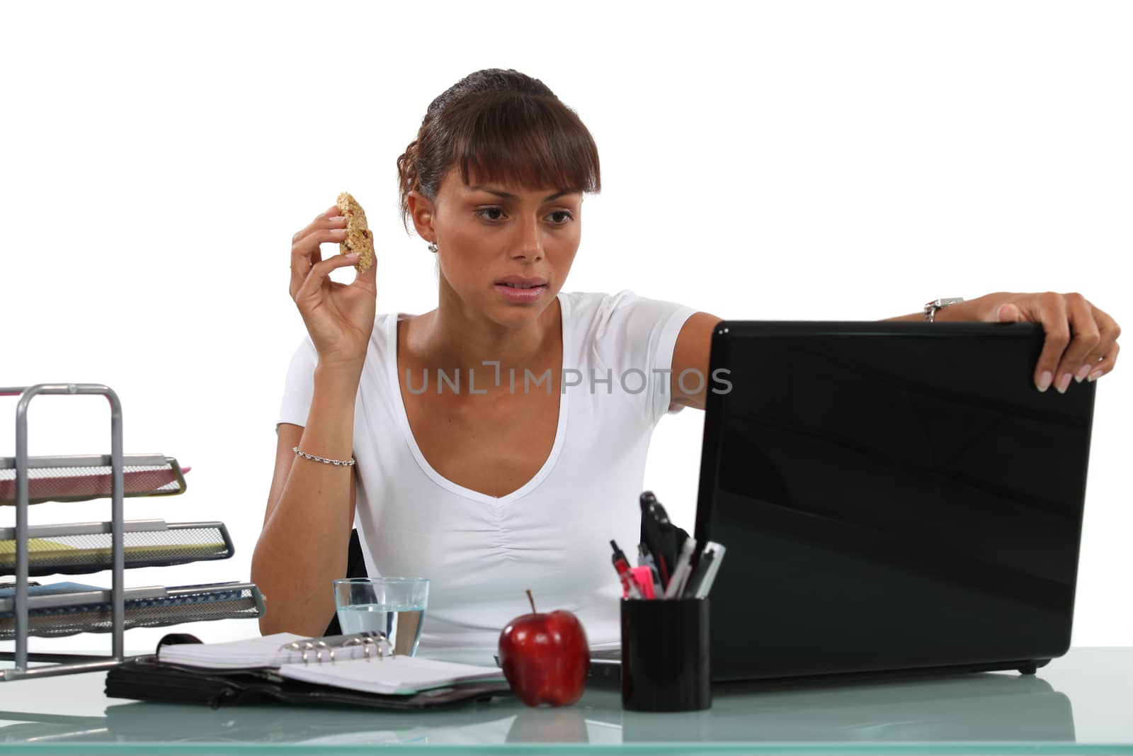 Eating at her desk