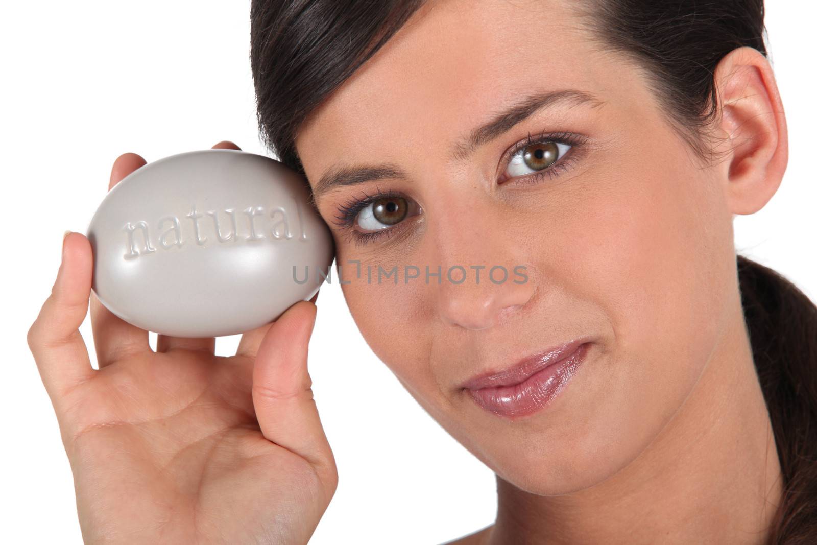 Woman holding large pebble by phovoir
