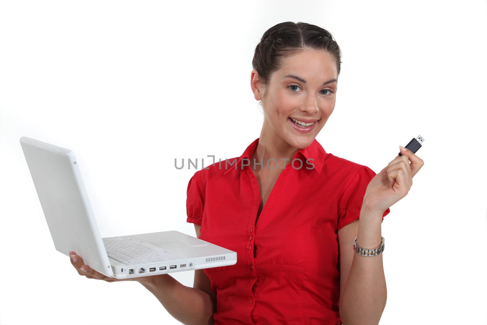 Woman with a laptop and usb key by phovoir