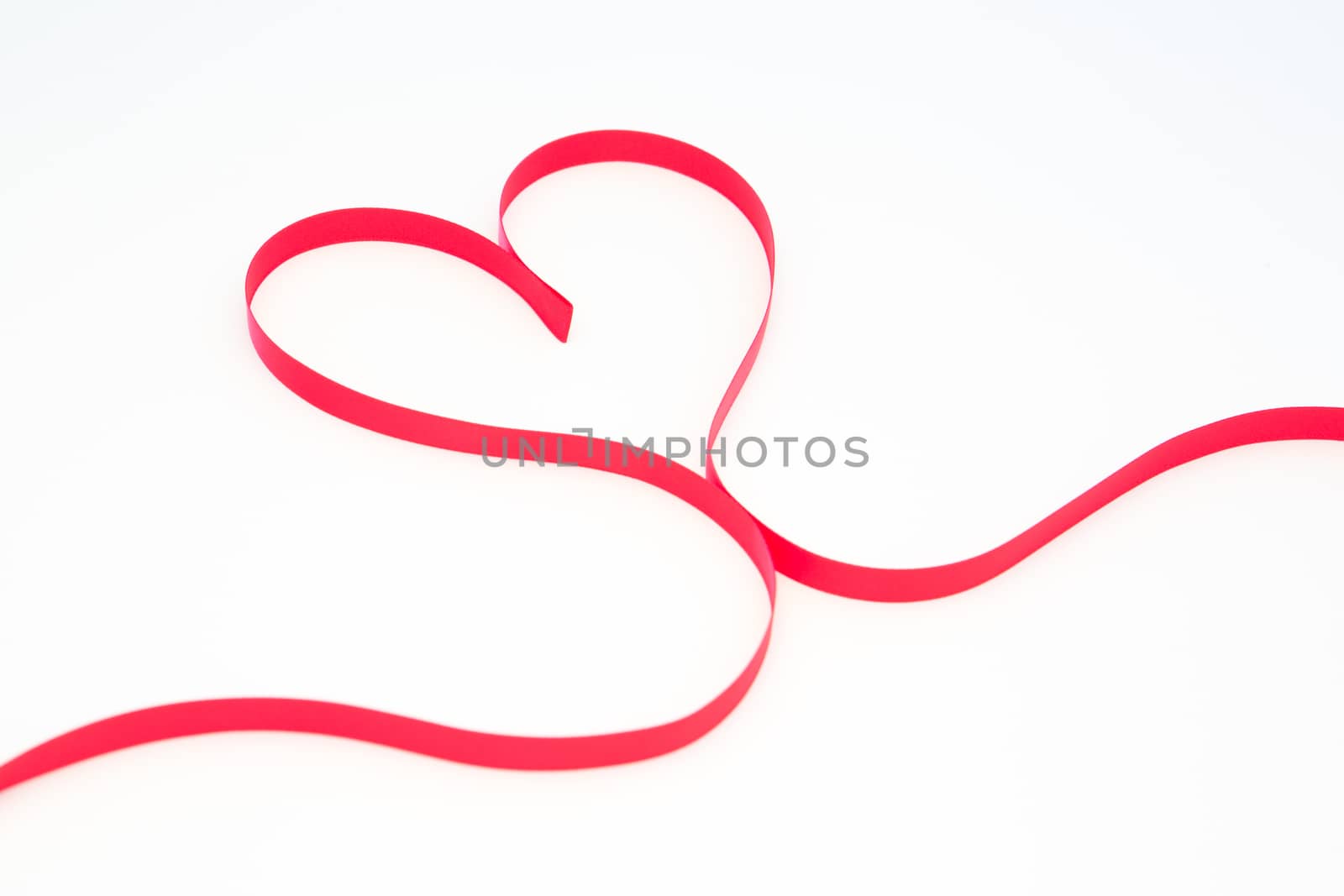 Pink ribbon in heart shape by Wavebreakmedia