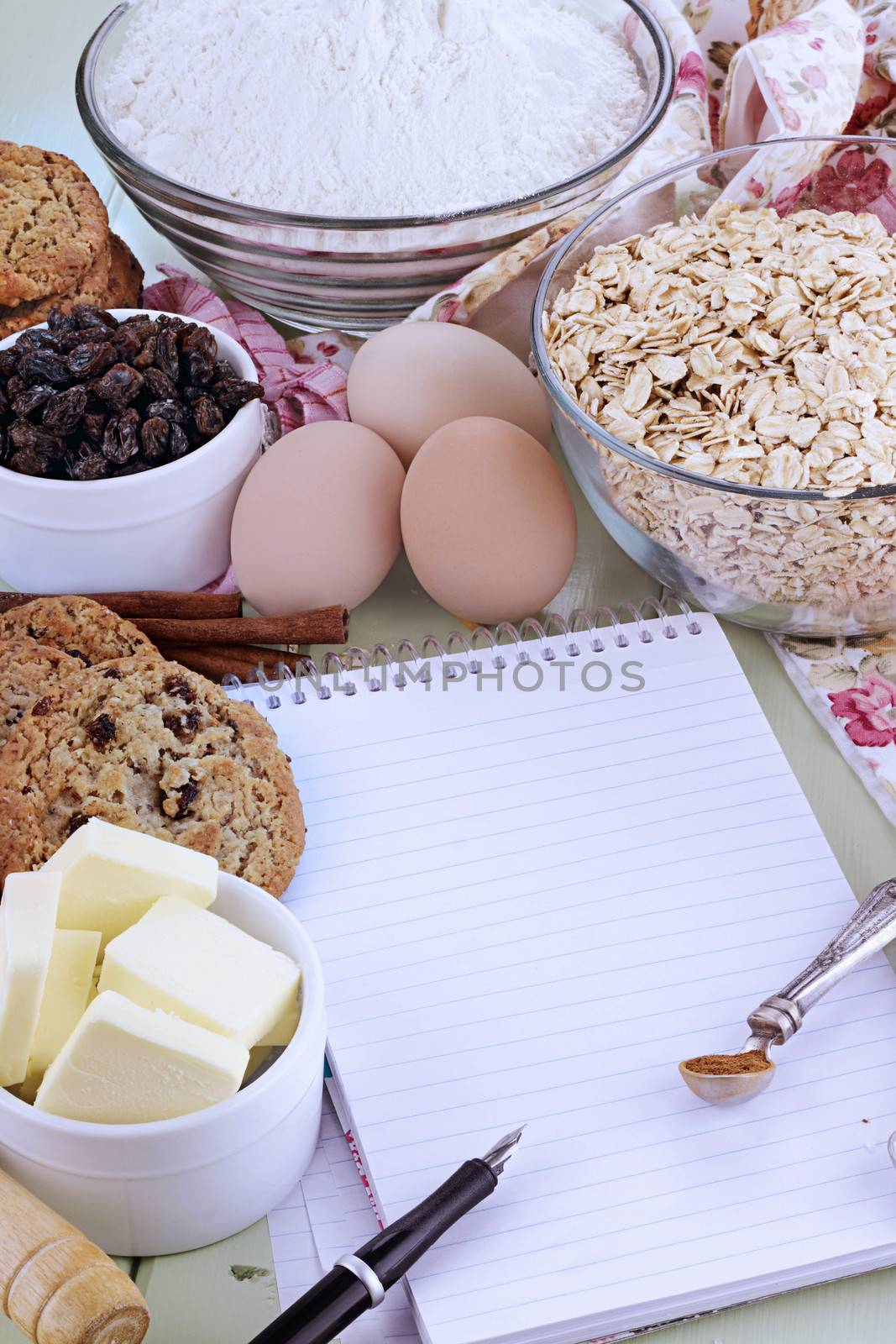 Fresh ingredients for oatmeal cookies with pen and paper. Shallow depth of field. 